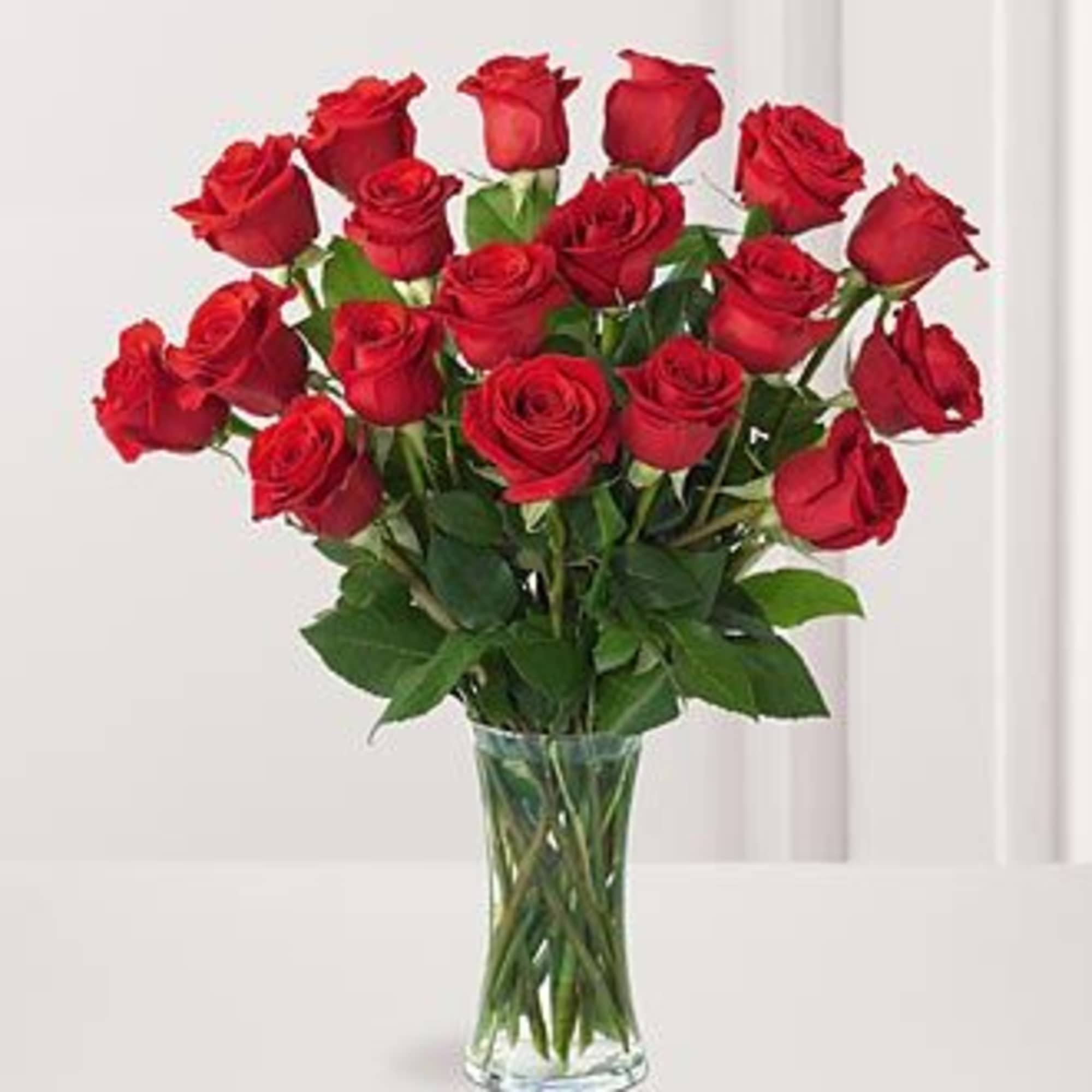 Bouquet of red roses in a clear glass vase