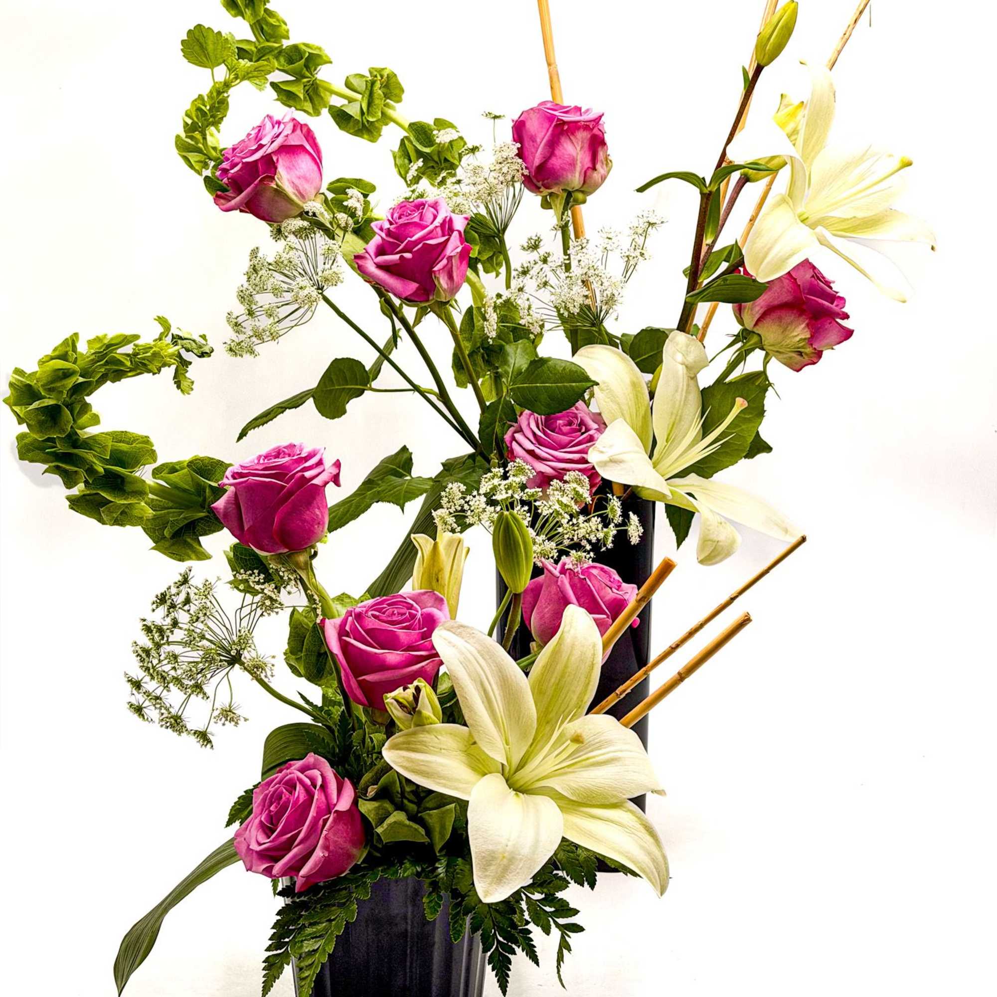 A graceful blend of lavender roses and elegant white lilies creates a, photo 2 of 2