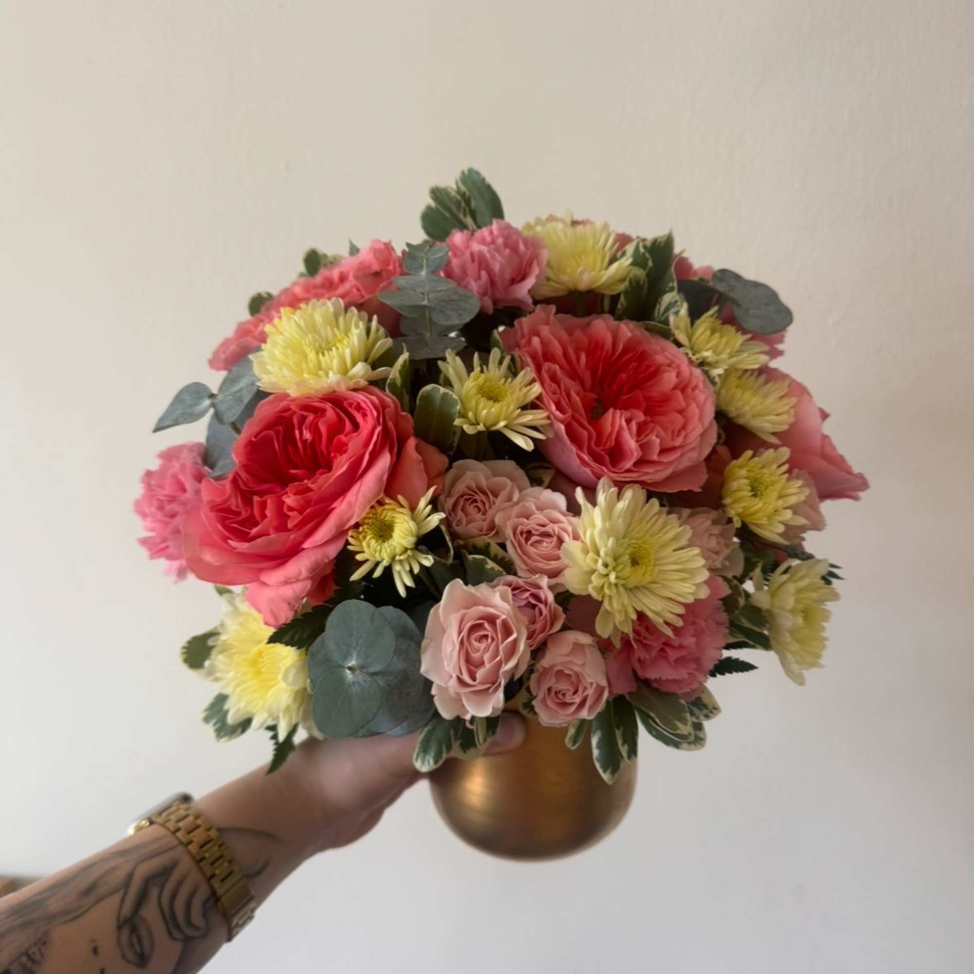 A cheerful garden-style arrangement filled with layers of soft pinks, buttery creams, photo 2 of 2