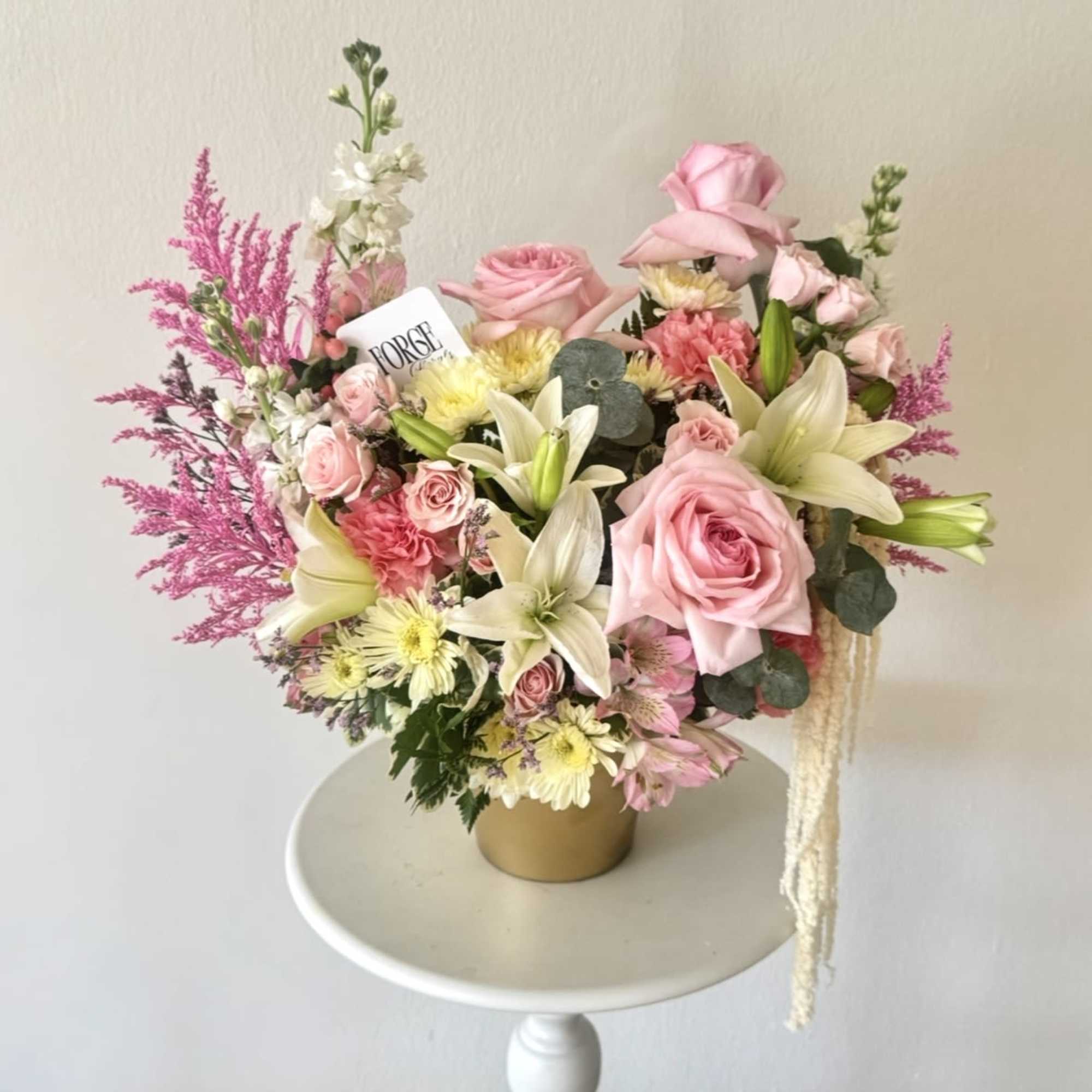 A lush garden-inspired arrangement featuring soft pink roses, delicate spray roses, elegant, photo 2 of 2