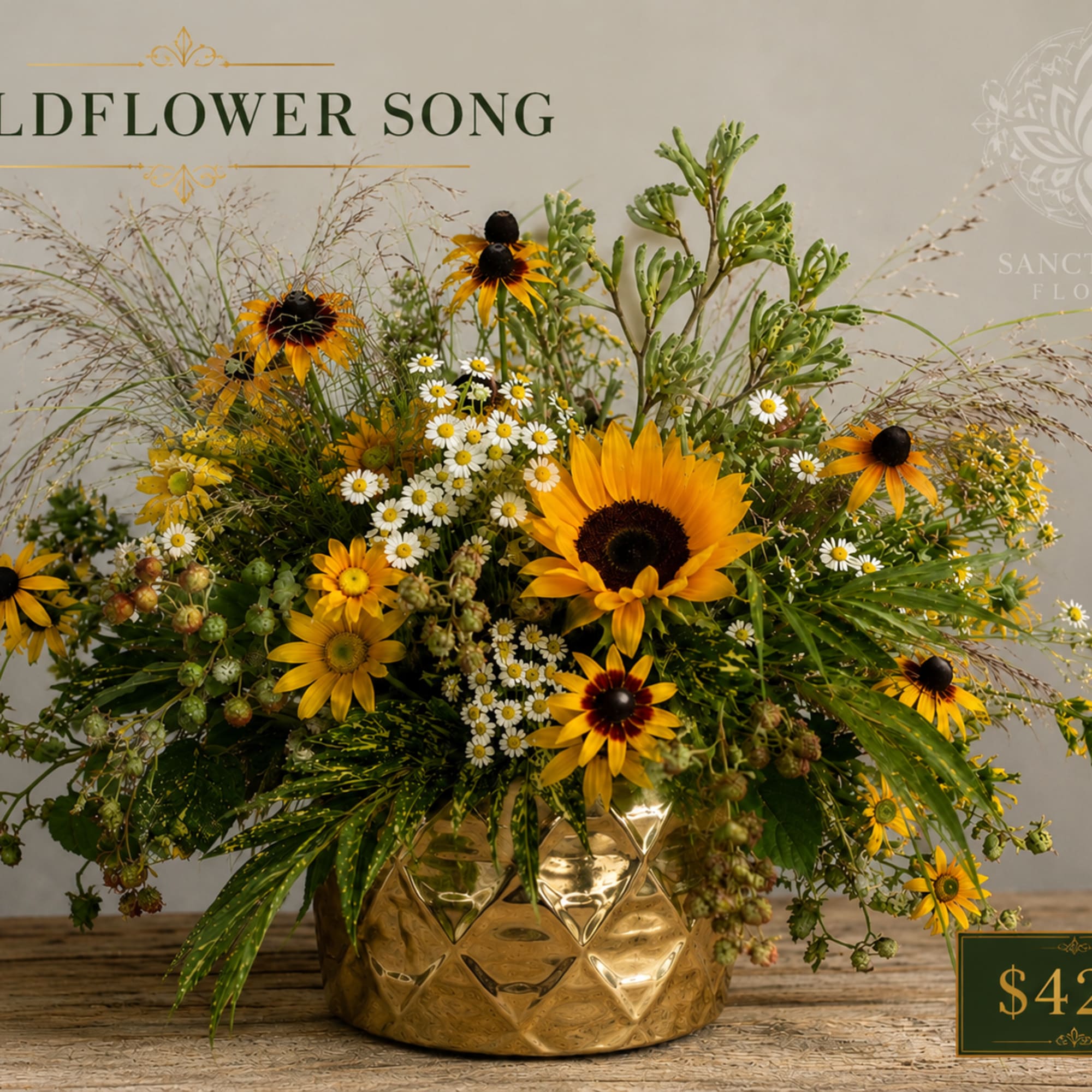 Sunflower and daisy arrangement in a gold vase