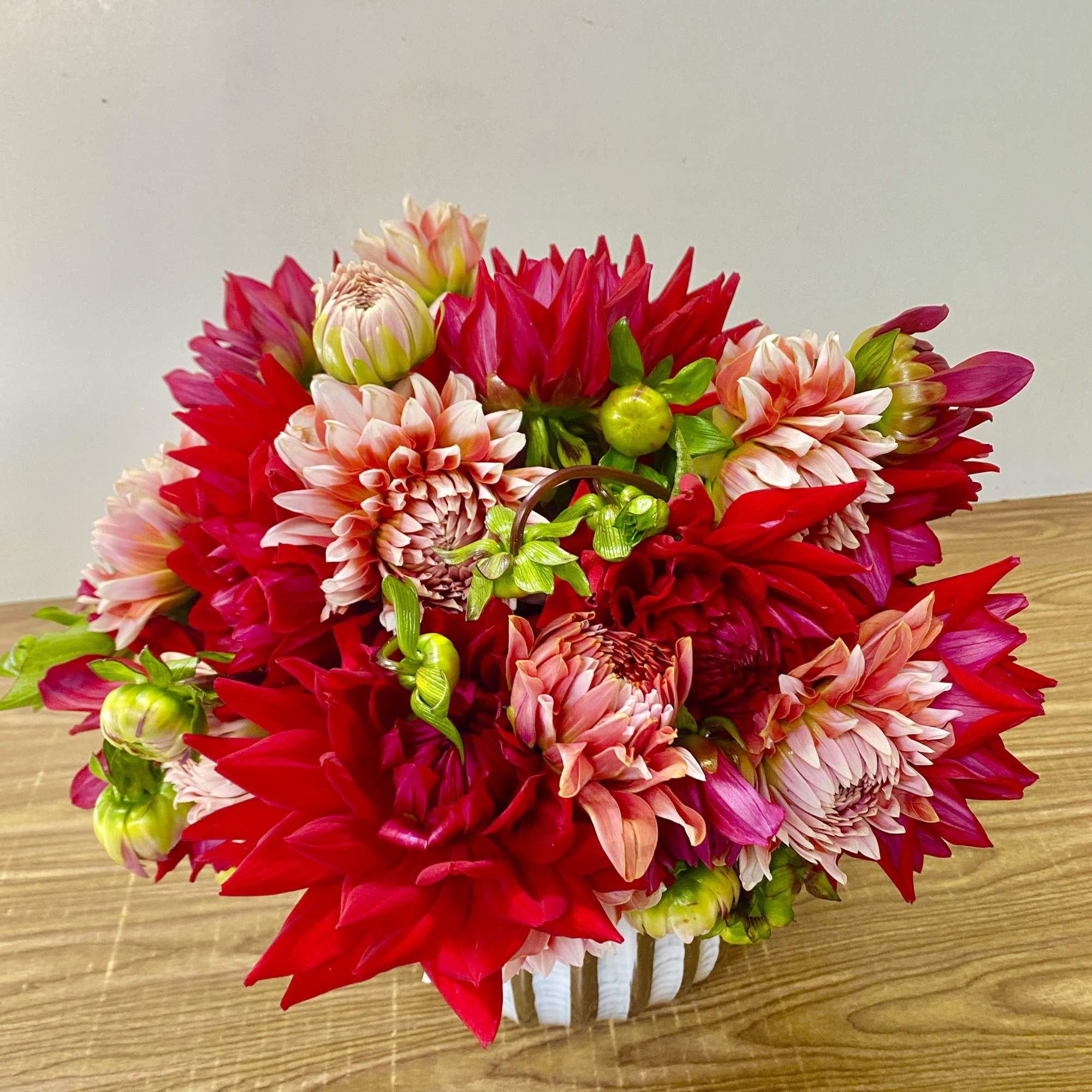 A stunning display of elegance and charm, this arrangement features a beautiful