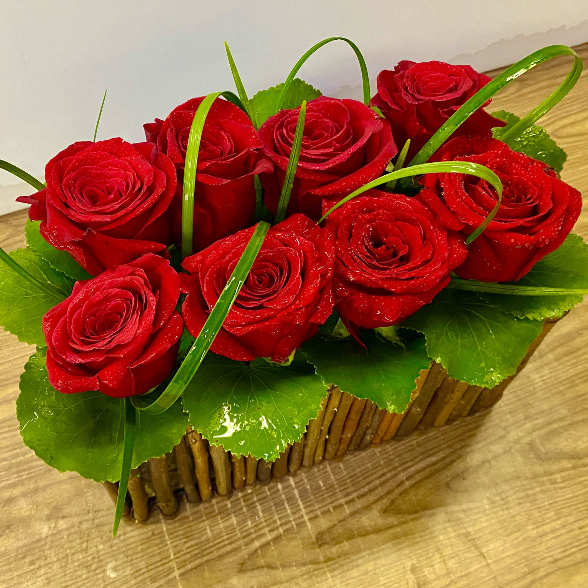 10 red roses in a wood basket , photo 2 of 3