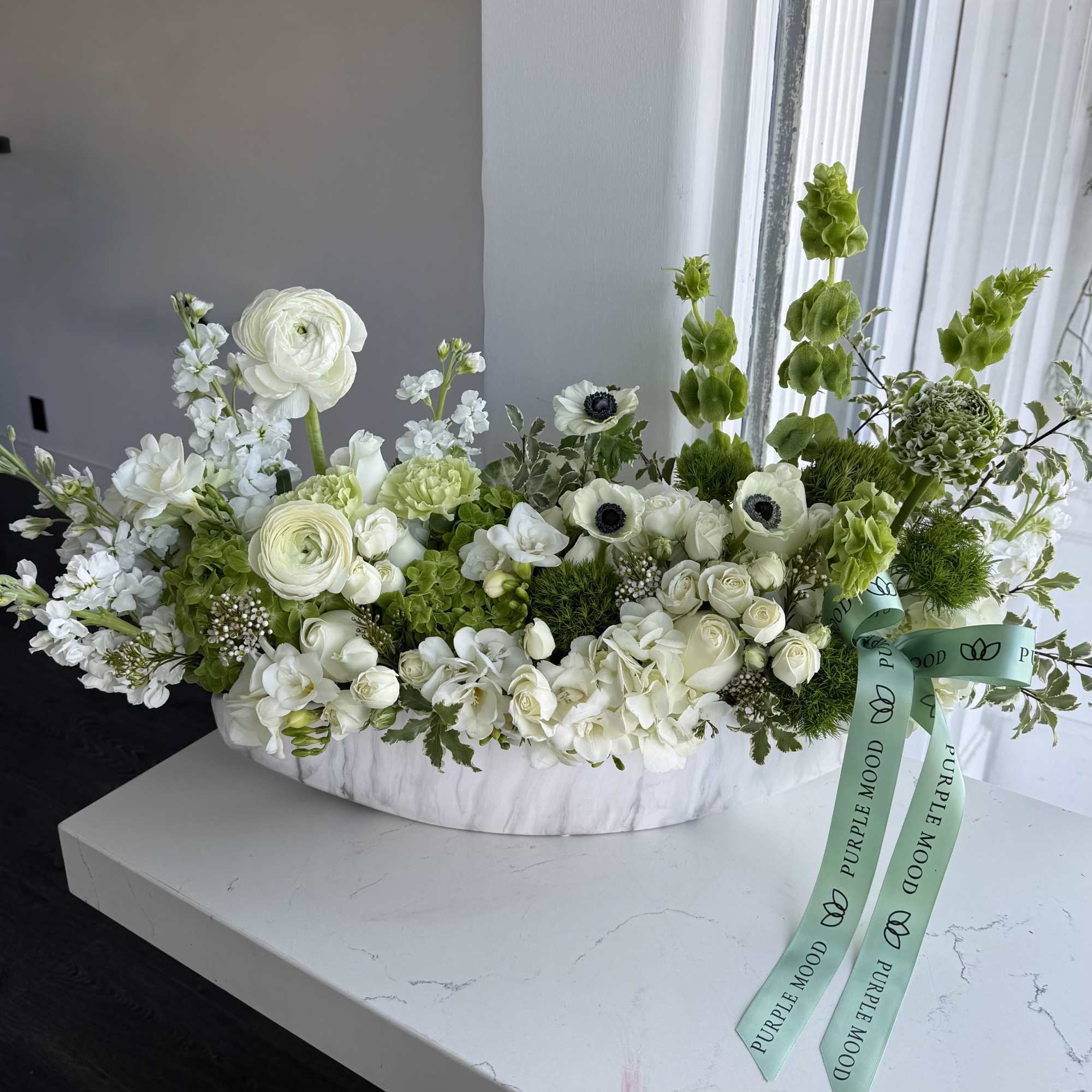 Fresh Green Vase is a refined white and green floral arrangement designed