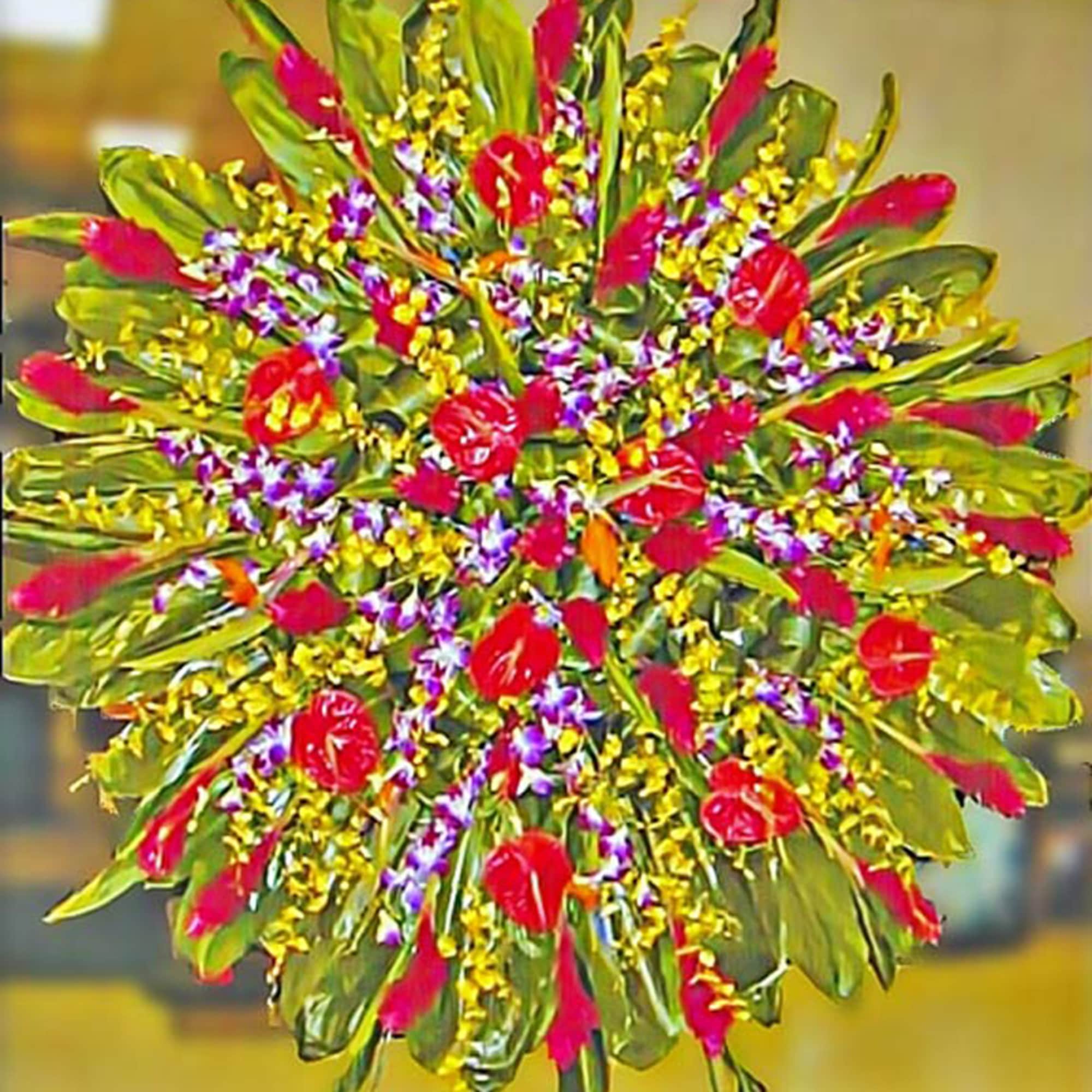 Large round standing spray of red tropical flowers with yellow and purple accents.