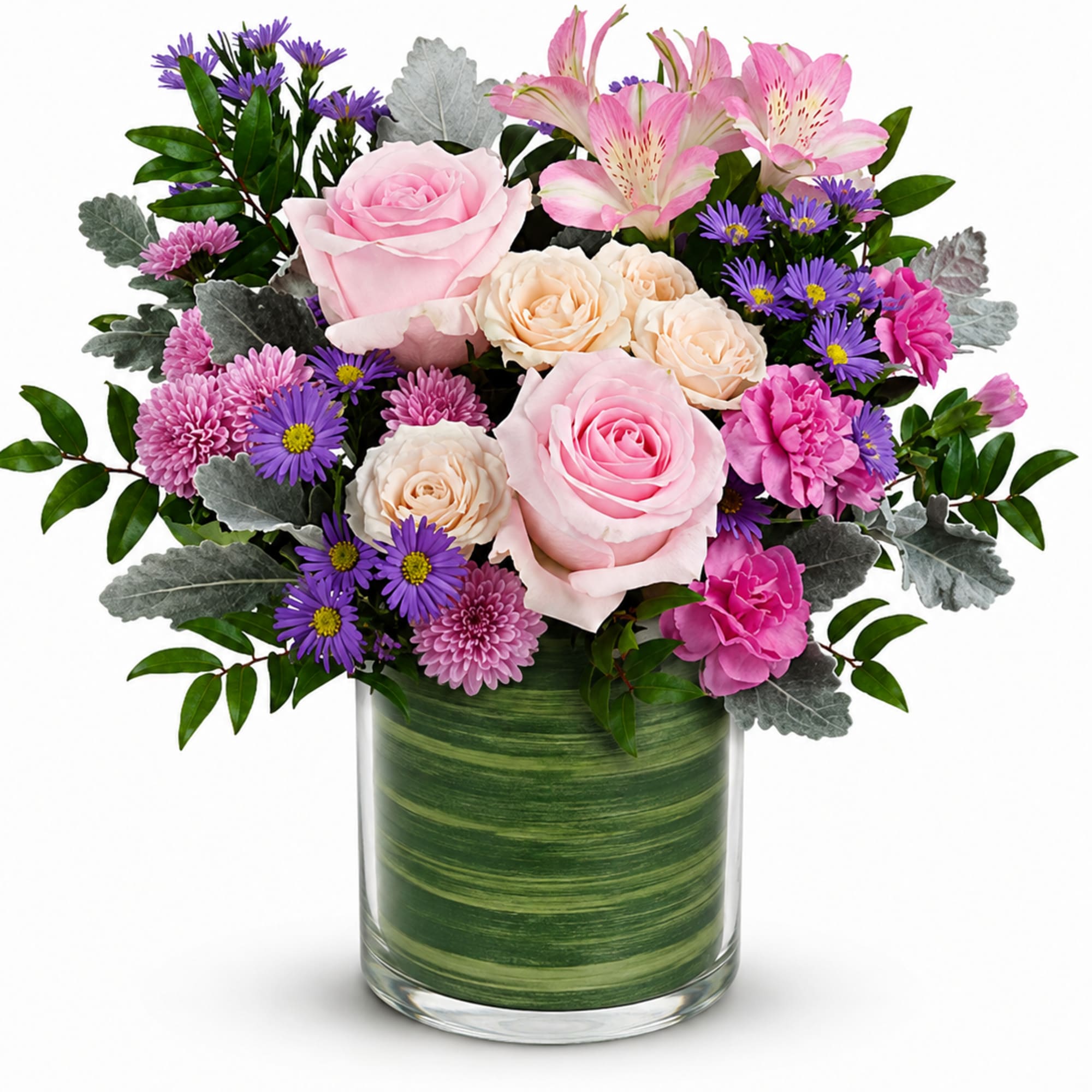 Pink and cream roses with purple daisies in a glass vase