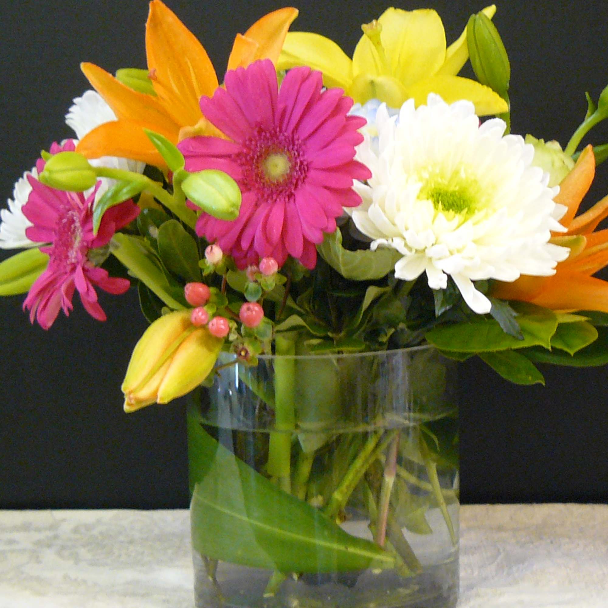 Colorful mixed bouquet in a clear glass vase
