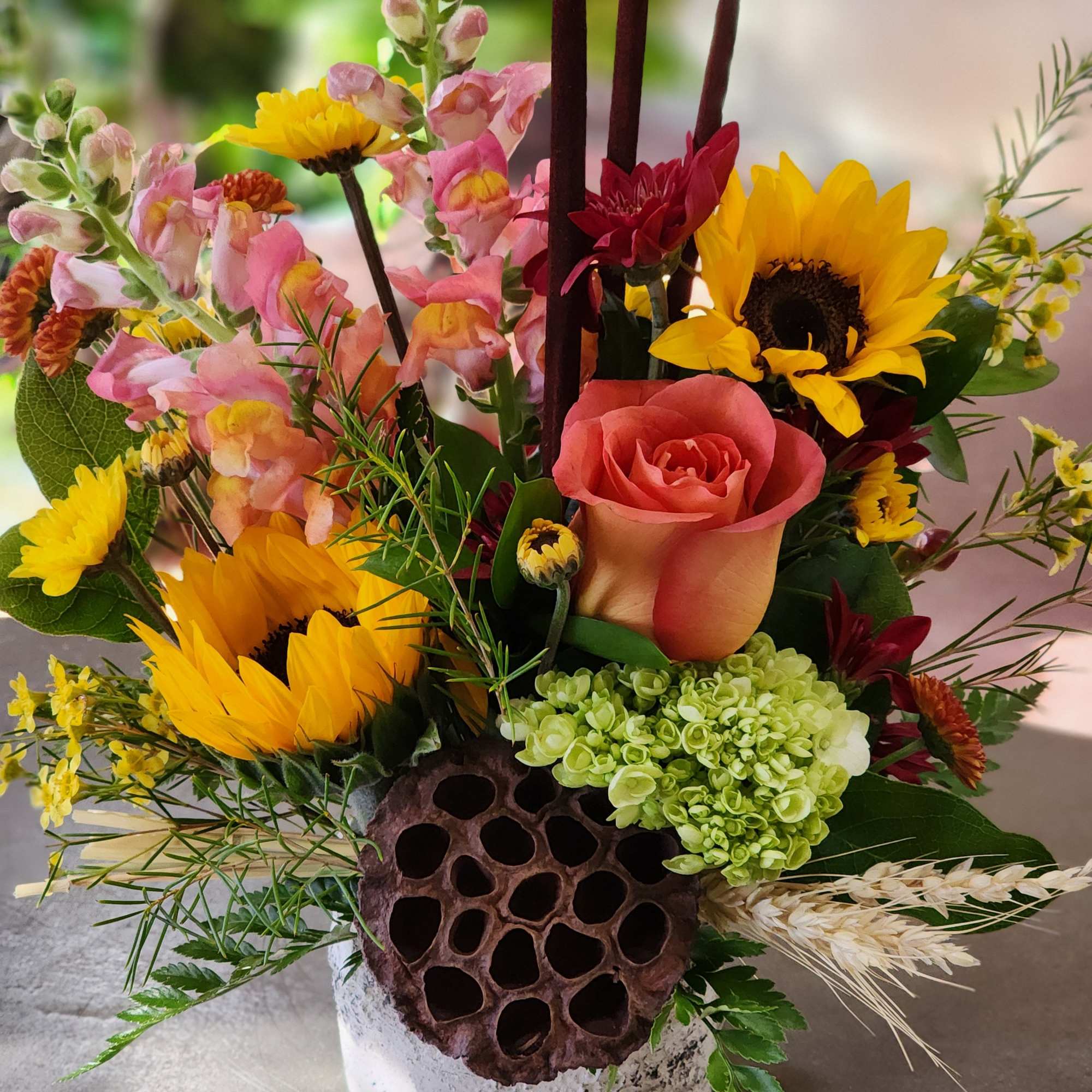 This beautiful rustic arrangement,  a sure sign of the fall season.