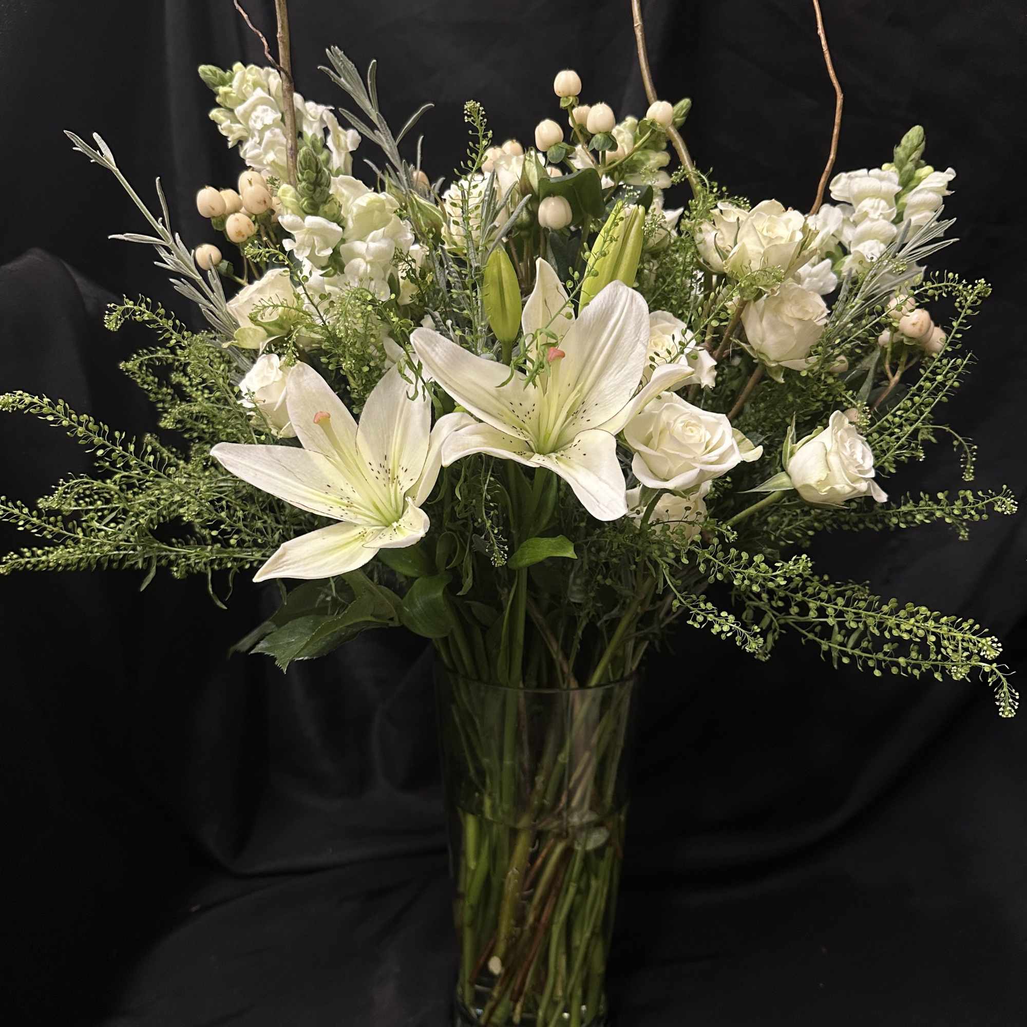 Serenity in blooms. This beautiful, two-toned arrangement is ideal for sympathy, weddings