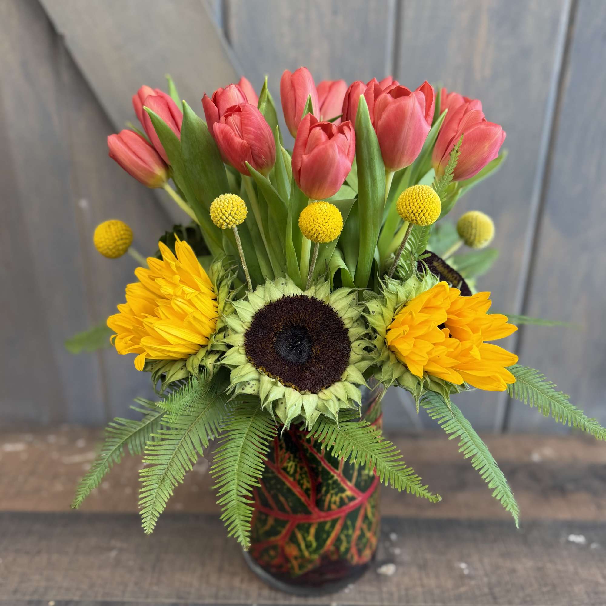 Tulip Canvas
A vibrant composition of tulips, sunflowers, petal-less sunflowers, billy balls, and, photo 2 of 2