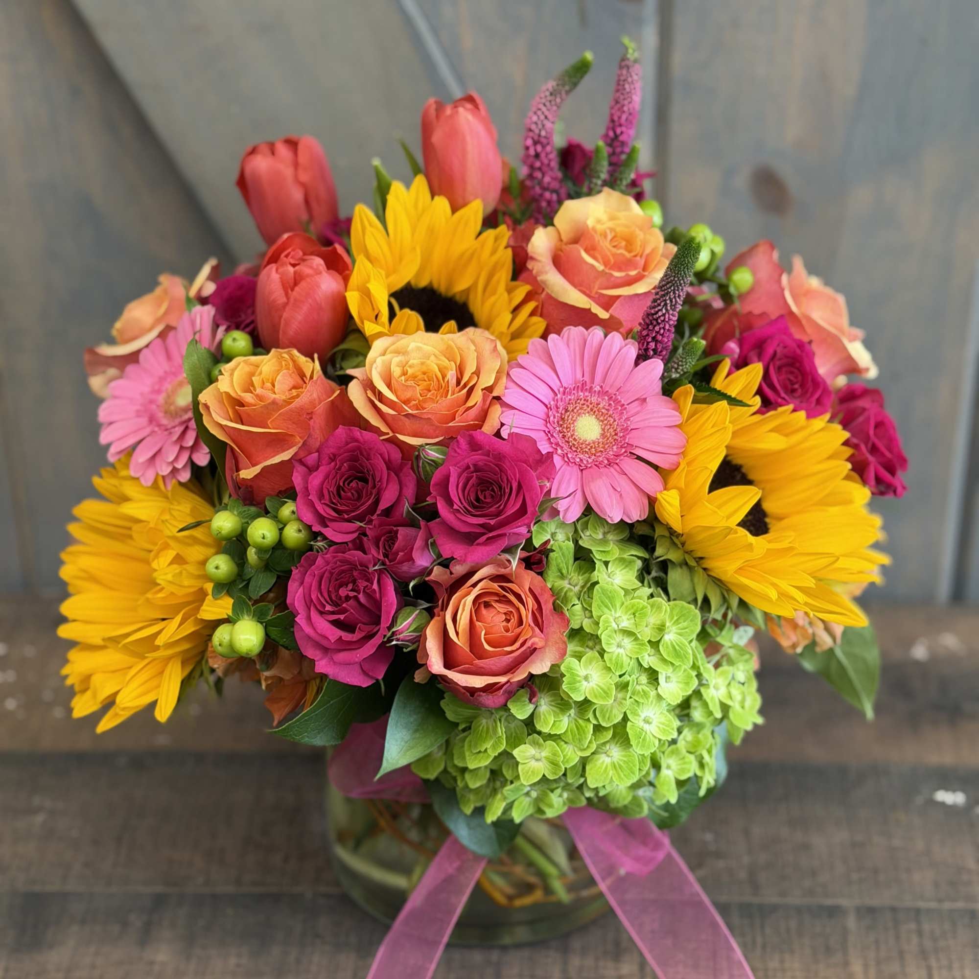 Via Campesina Garden
A lush, garden-style arrangement designed with sunflowers, roses, spray roses, photo 2 of 3