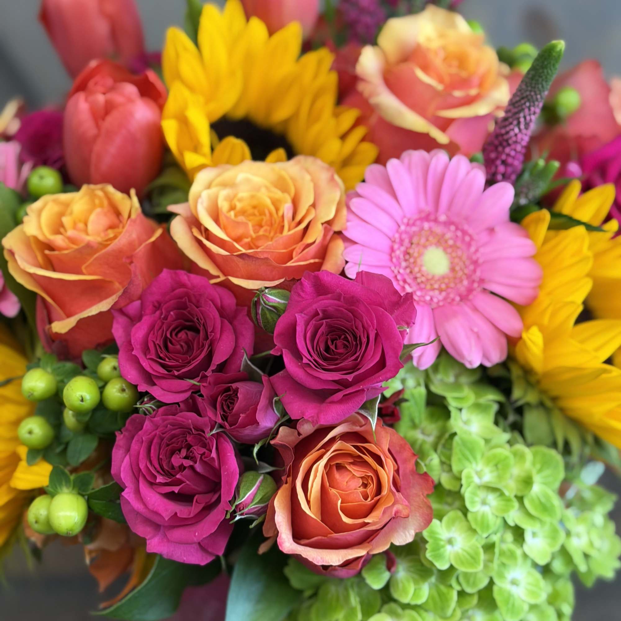 Via Campesina Garden
A lush, garden-style arrangement designed with sunflowers, roses, spray roses, photo 3 of 3