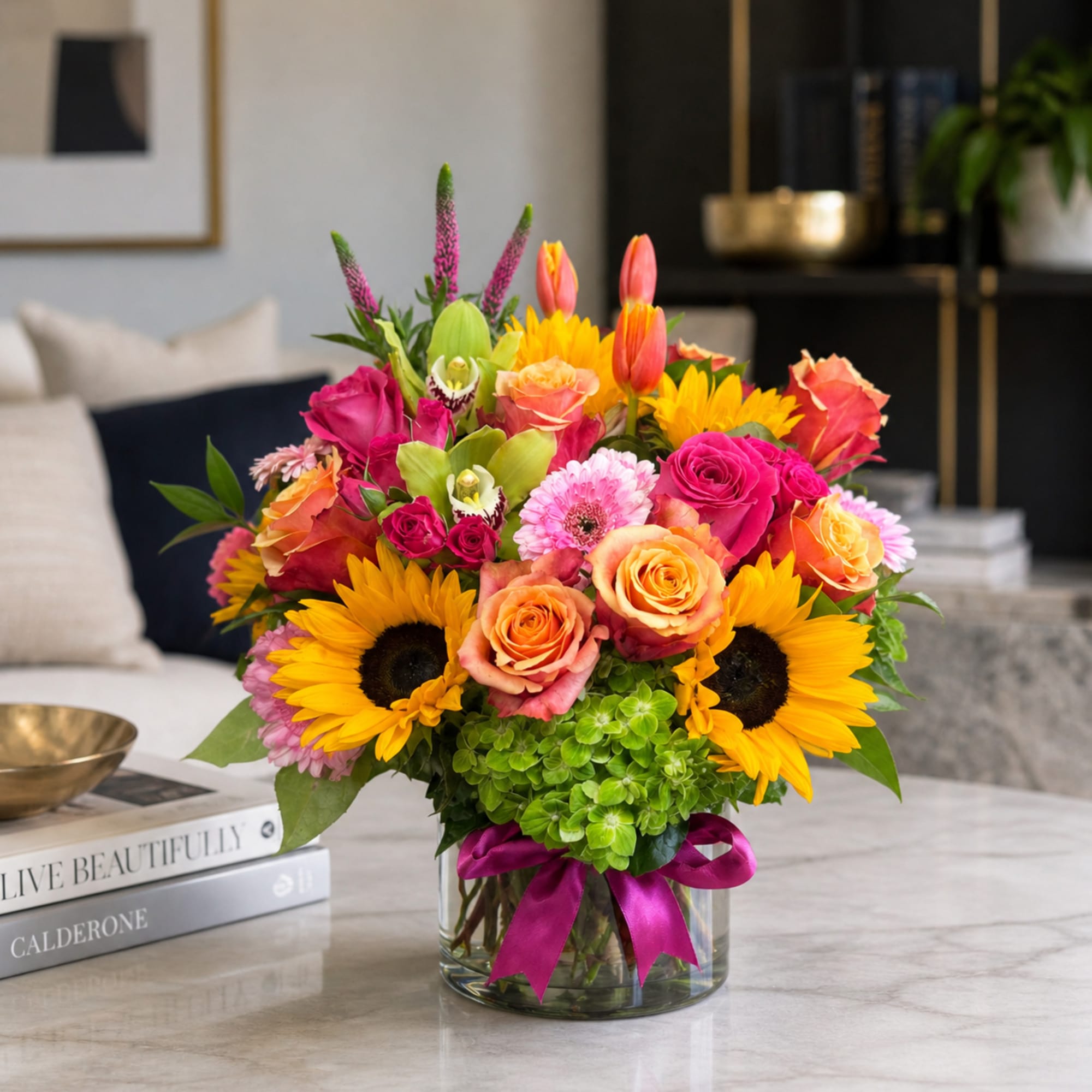 Via Campesina Garden
A lush, garden-style arrangement designed with sunflowers, roses, spray roses