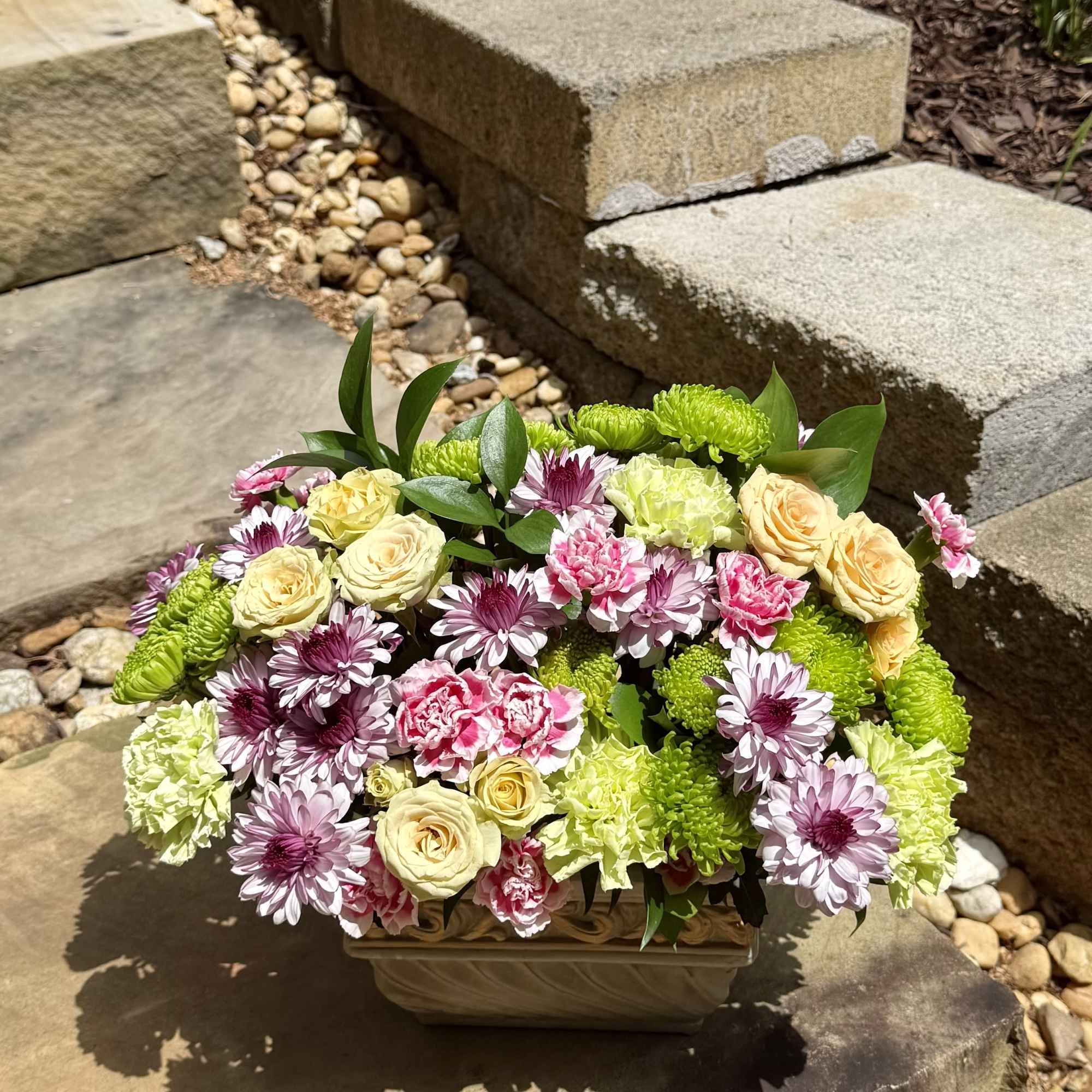 A lush blend of roses, carnations, and daisies in soft pastels and, photo 2 of 2