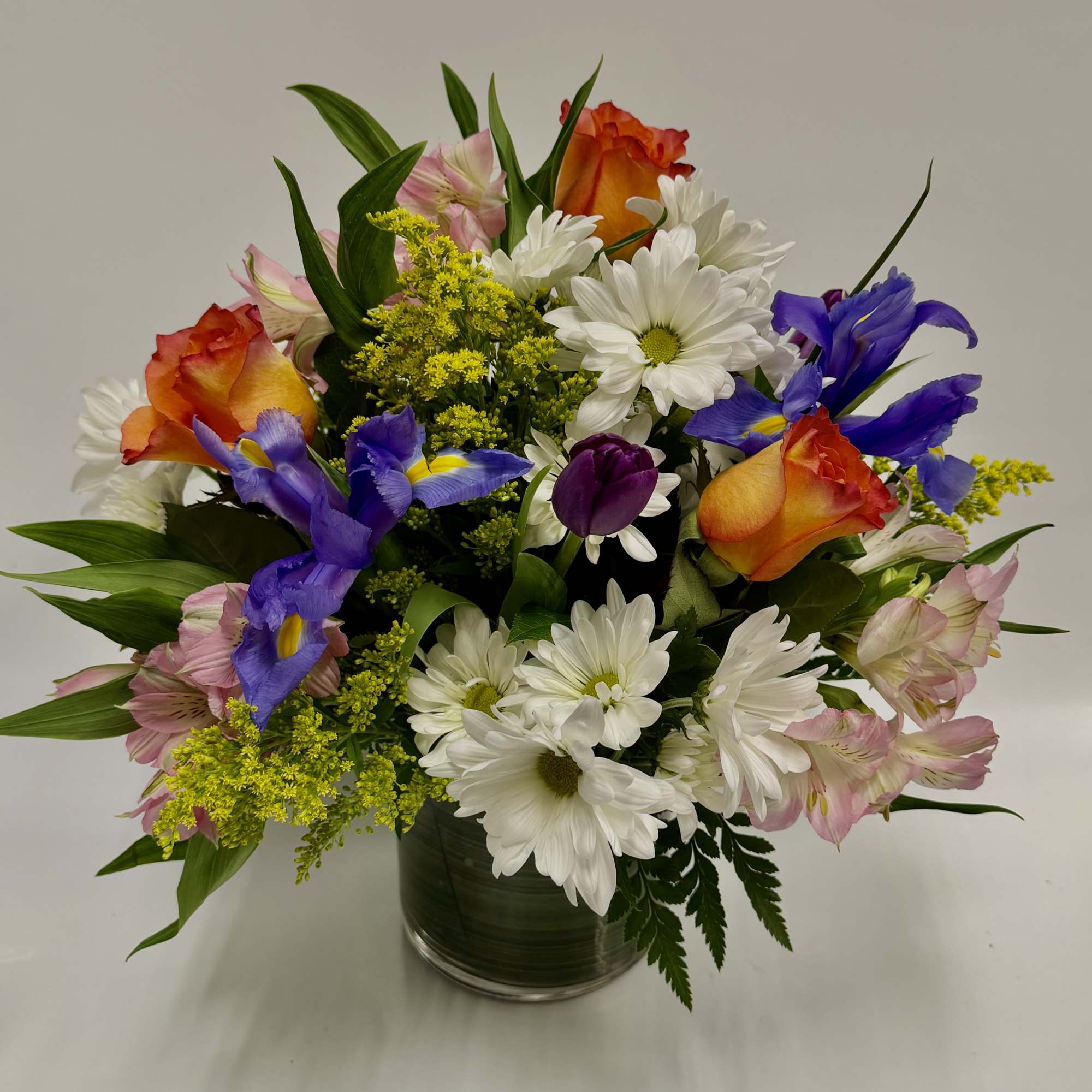 MIXTURE OF SPRING WHITE DAISIES, IRIS, TULIPS, ALSTROMERIAS, &amp; SEASONAL FILLERS LIKE