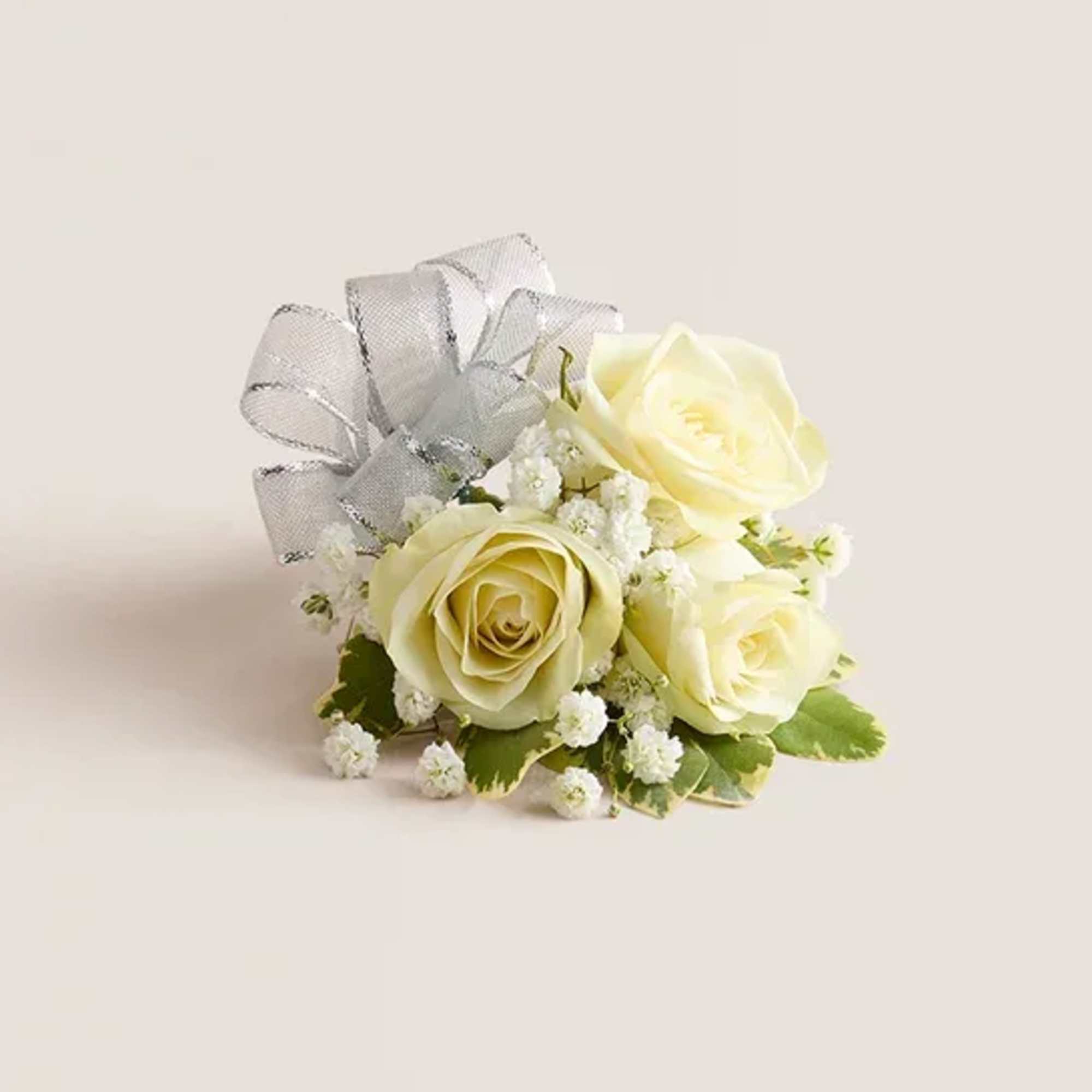 Small bouquet of pale yellow roses with a silver ribbon bow
