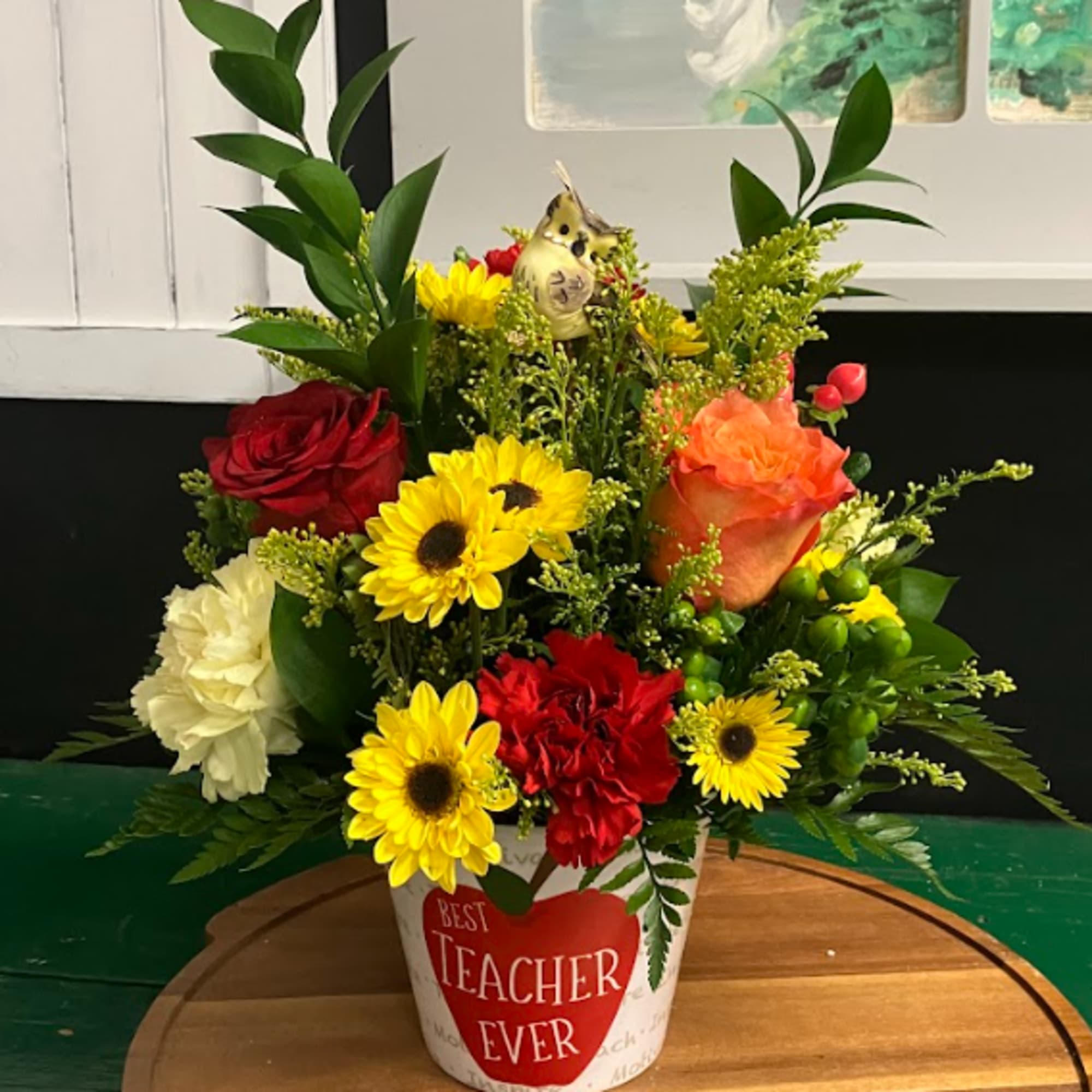 Mixed bouquet in a white pot with a "Best Teacher Ever" label