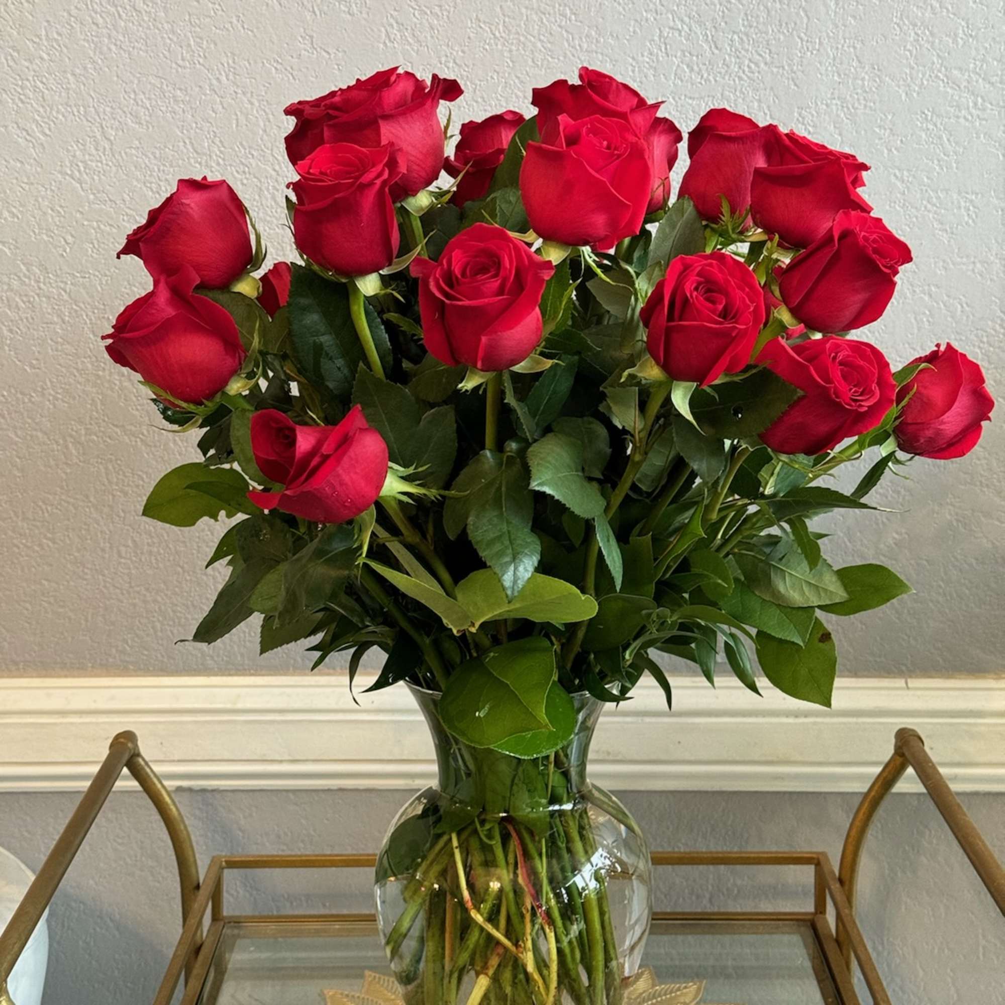 Bouquet of red roses in a clear glass vase