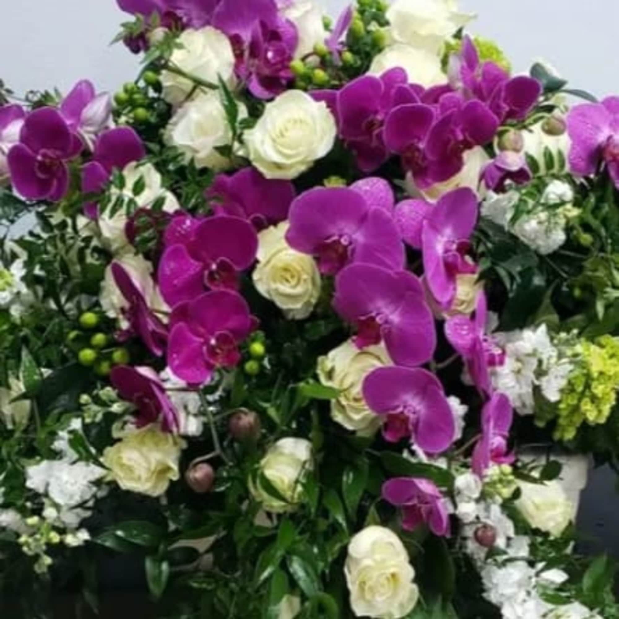 This full-size casket spray is a graceful and luxurious tribute, featuring elegant, photo 2 of 2