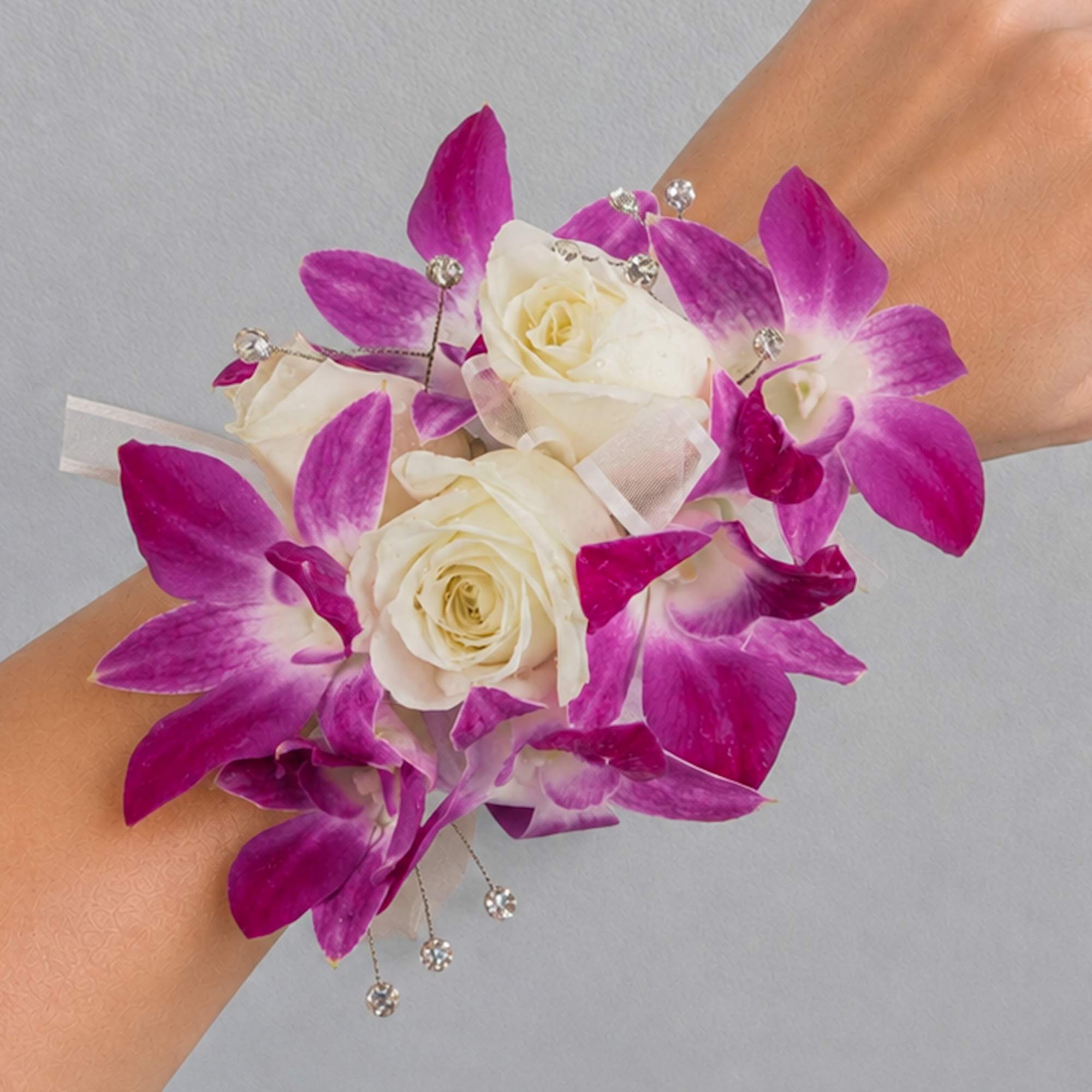 Wrist corsage with white roses and purple orchids, photo 2 of 2