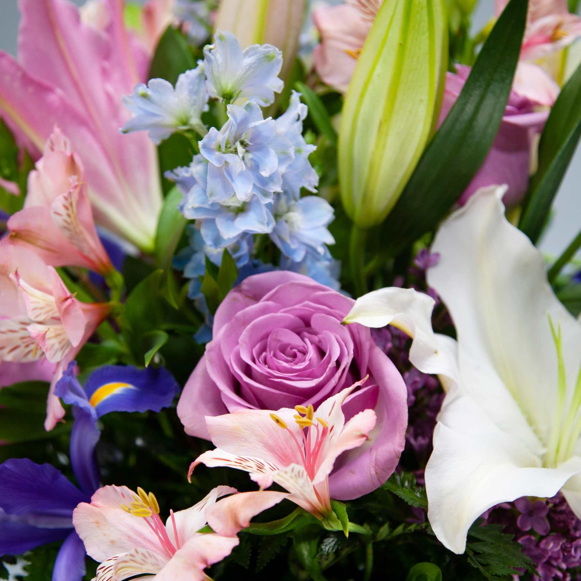 Bouquet of lilies, roses, and mixed pastel flowers