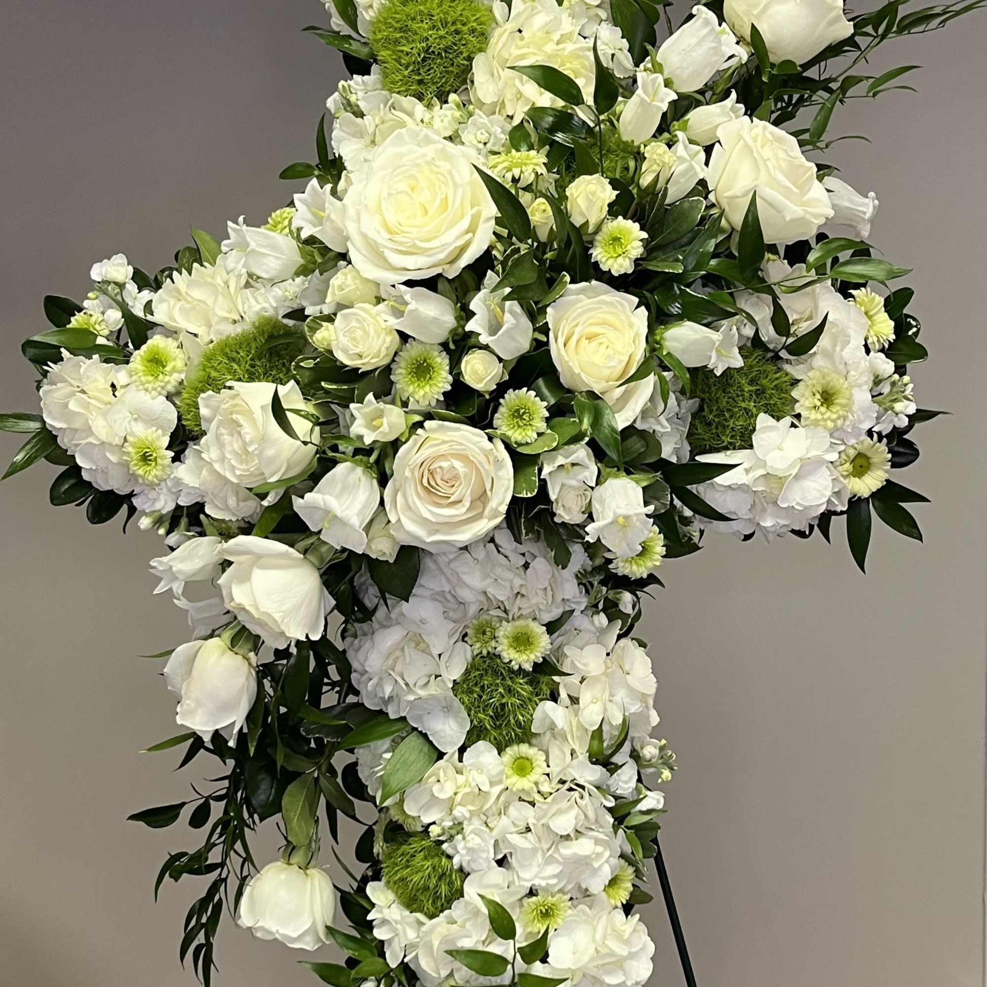 Sending love and comfort through faith with this elegant cross. White and