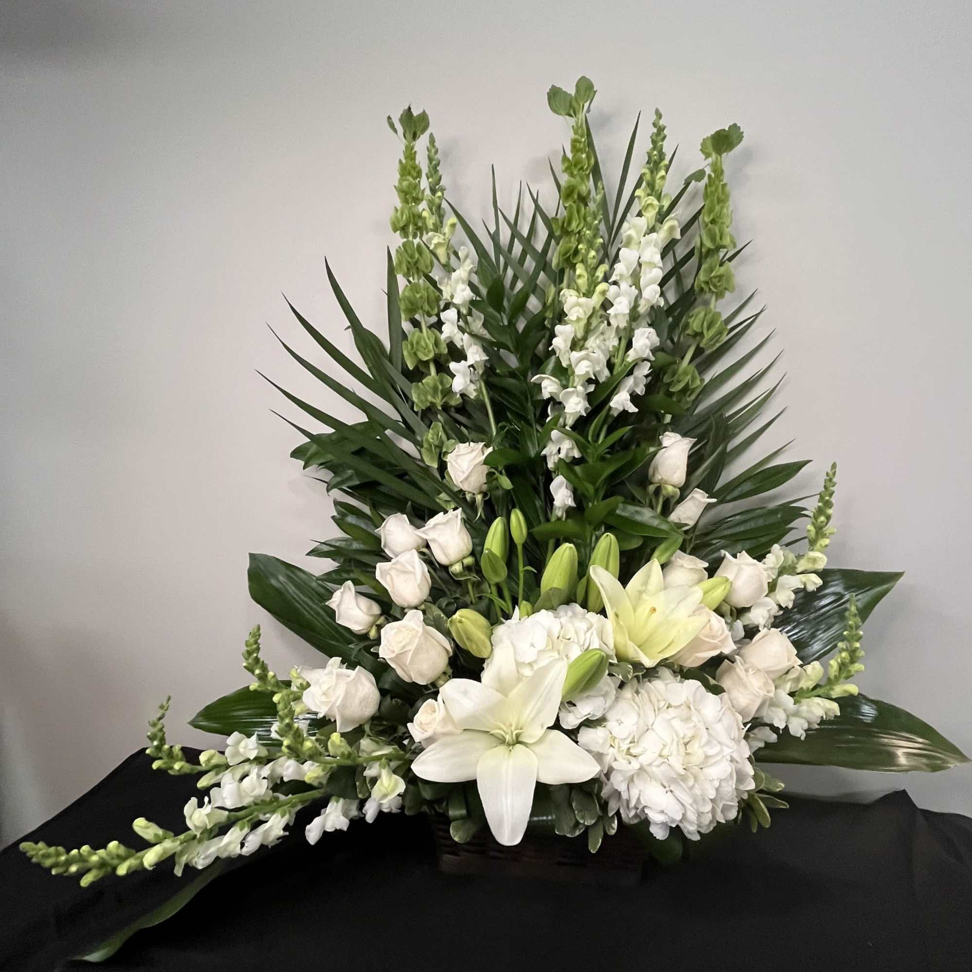 Garden of Peace is a serene, elegant arrangement designed to evoke calm