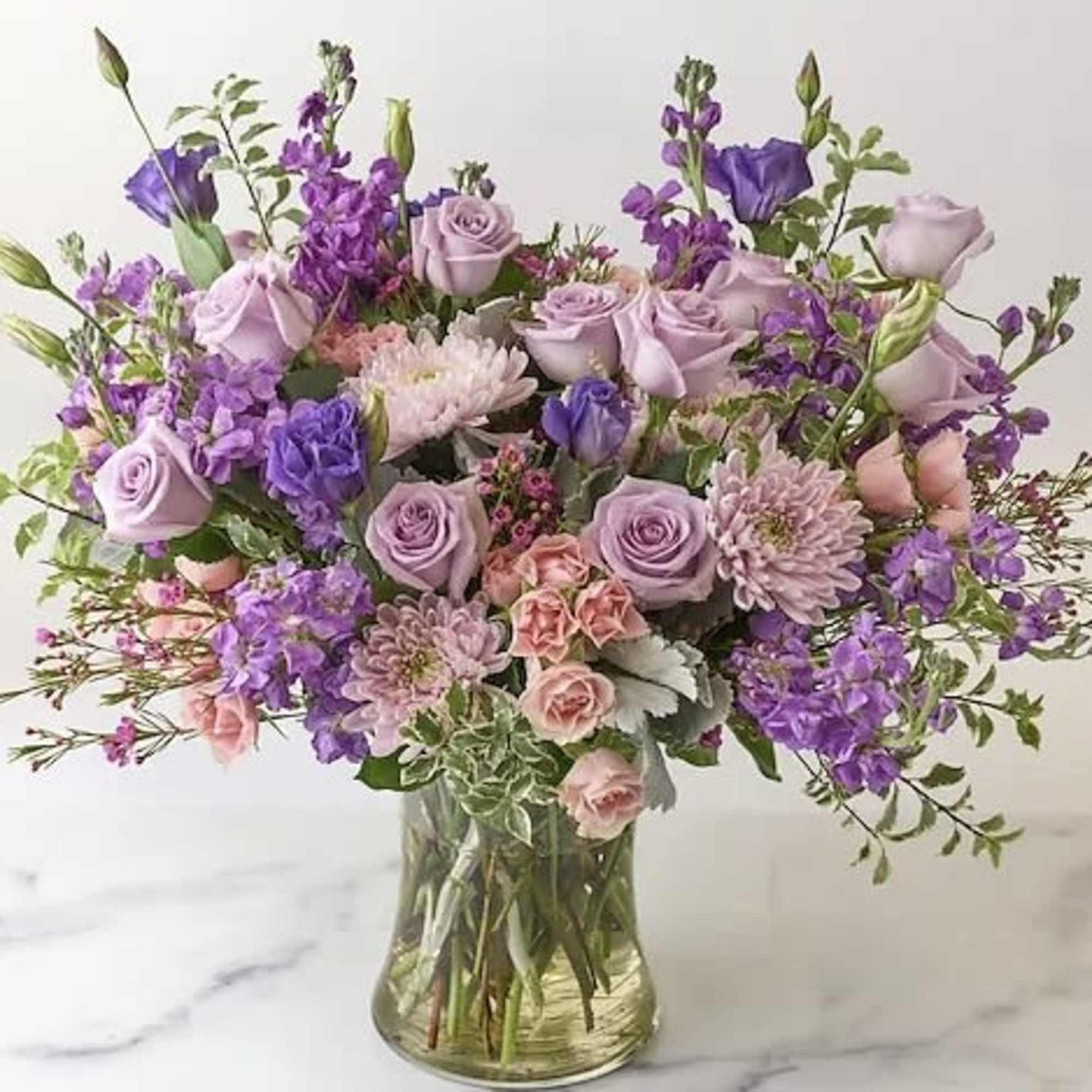 Select our Designer's Choice - Lavender Blooms Bouquet arrangement to brighten your