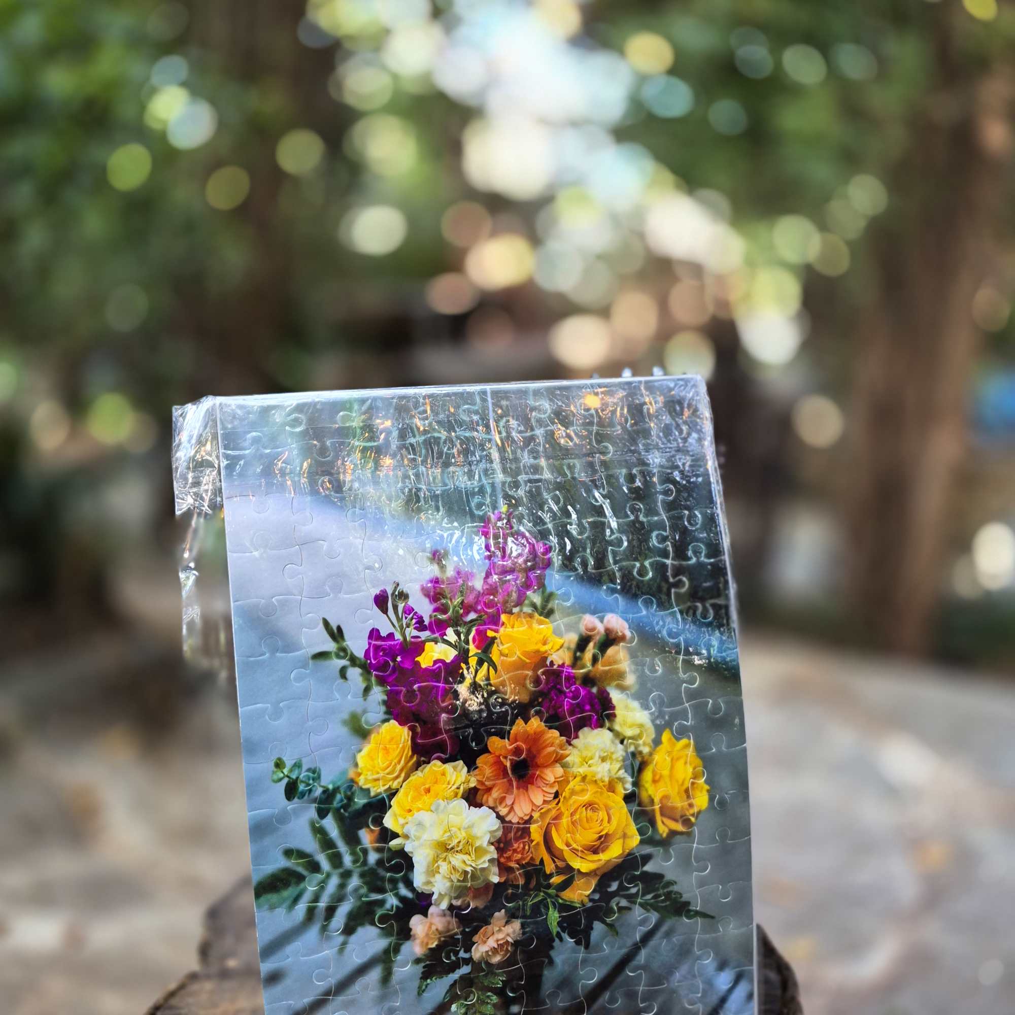 Puzzle board printed with a colorful bouquet of yellow, orange, and purple flowers