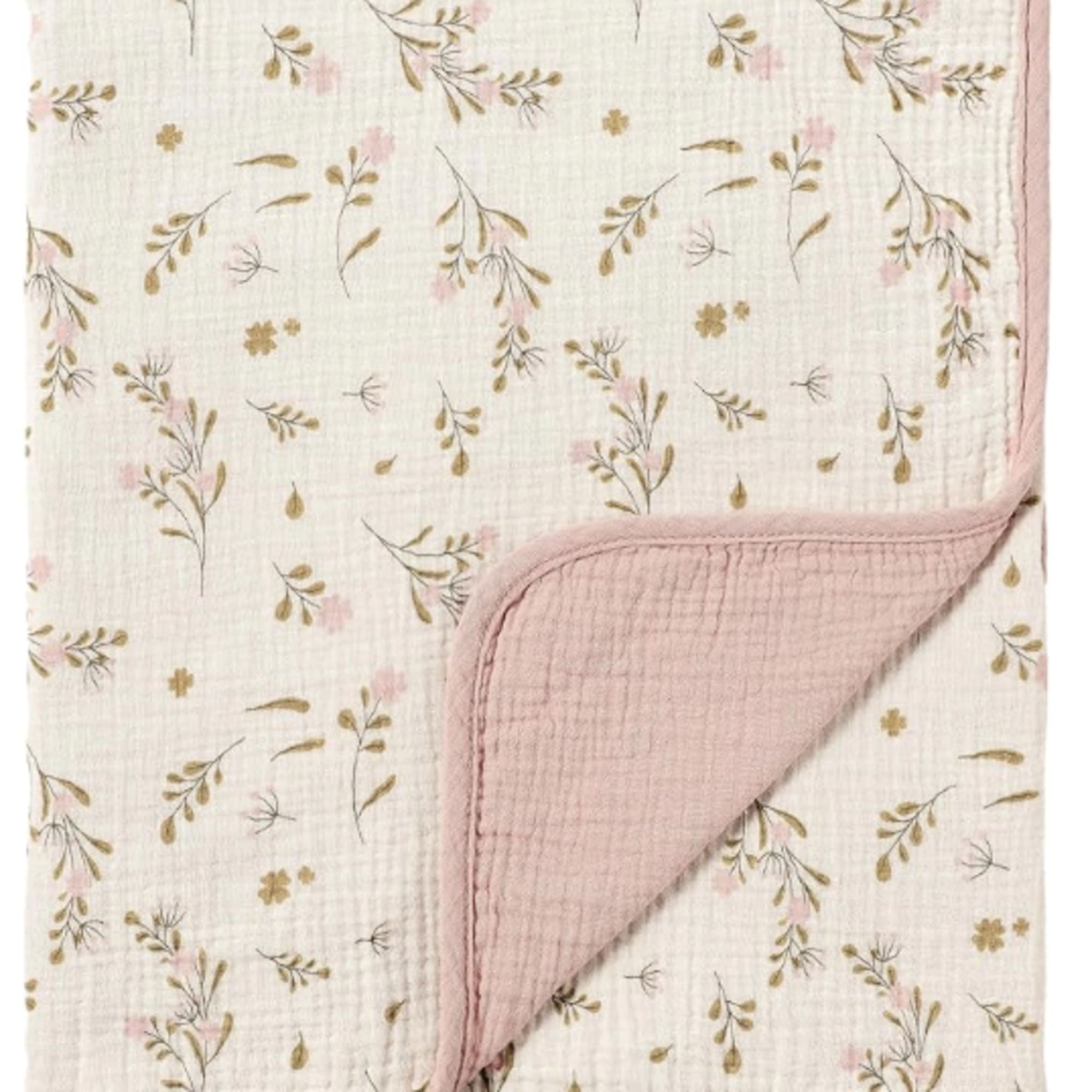 Folded quilted blanket with a pink floral print and blush trim
