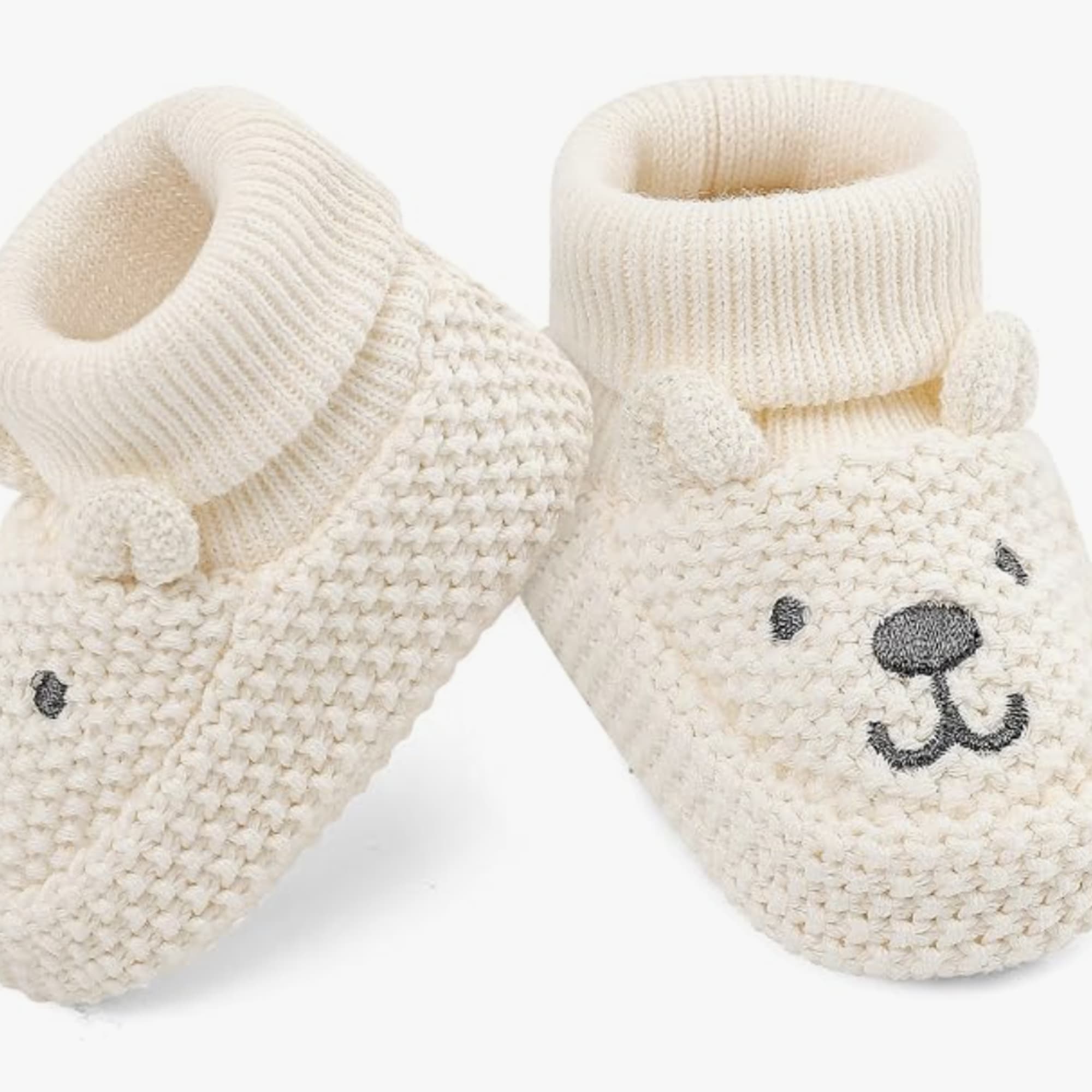 Pair of cream knitted baby booties with bear faces