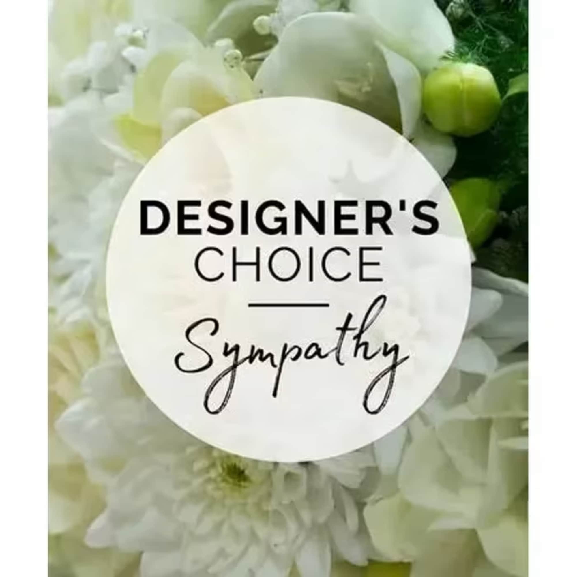 White floral sympathy arrangement with a designer's choice sign