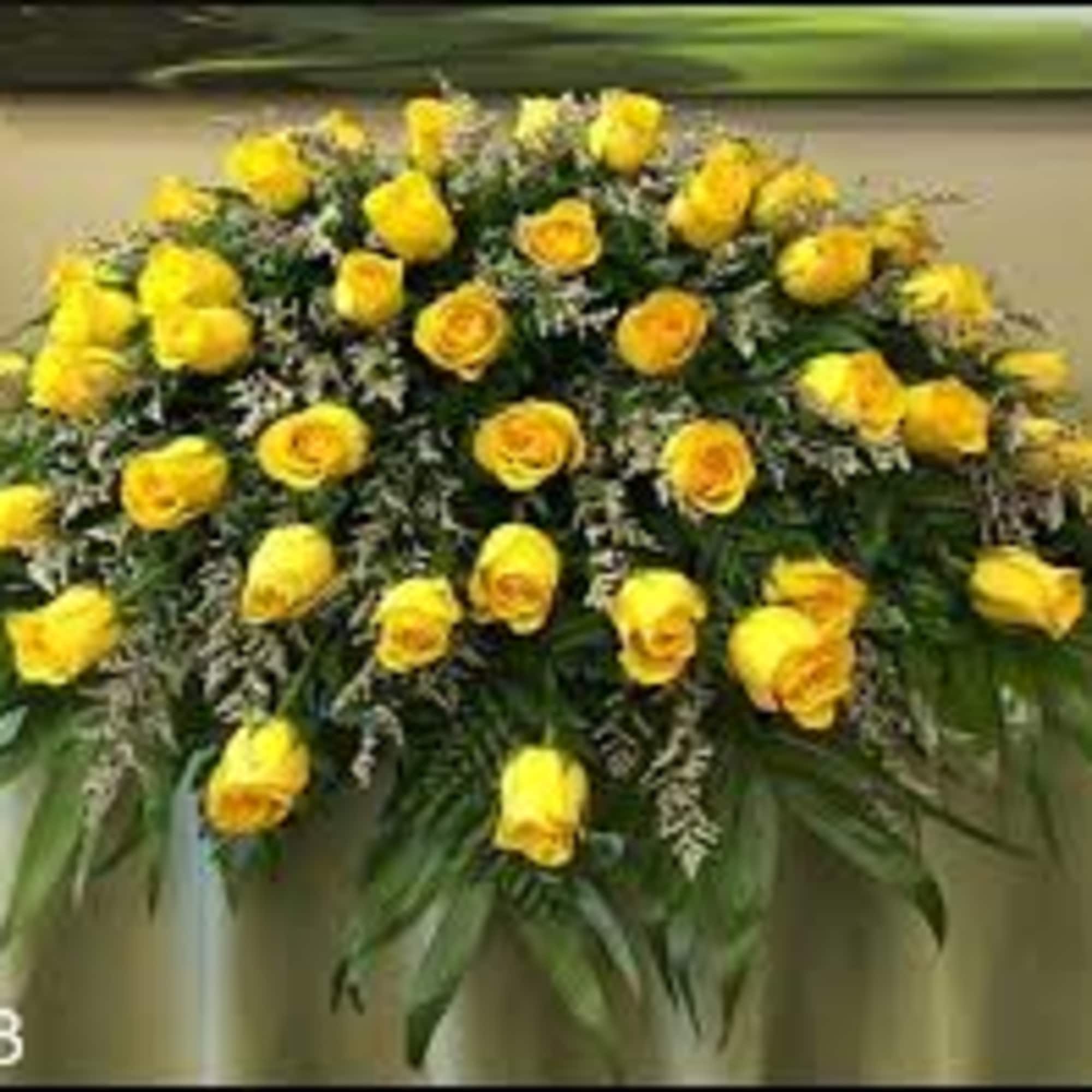Yellow rose spray arrangement with greenery