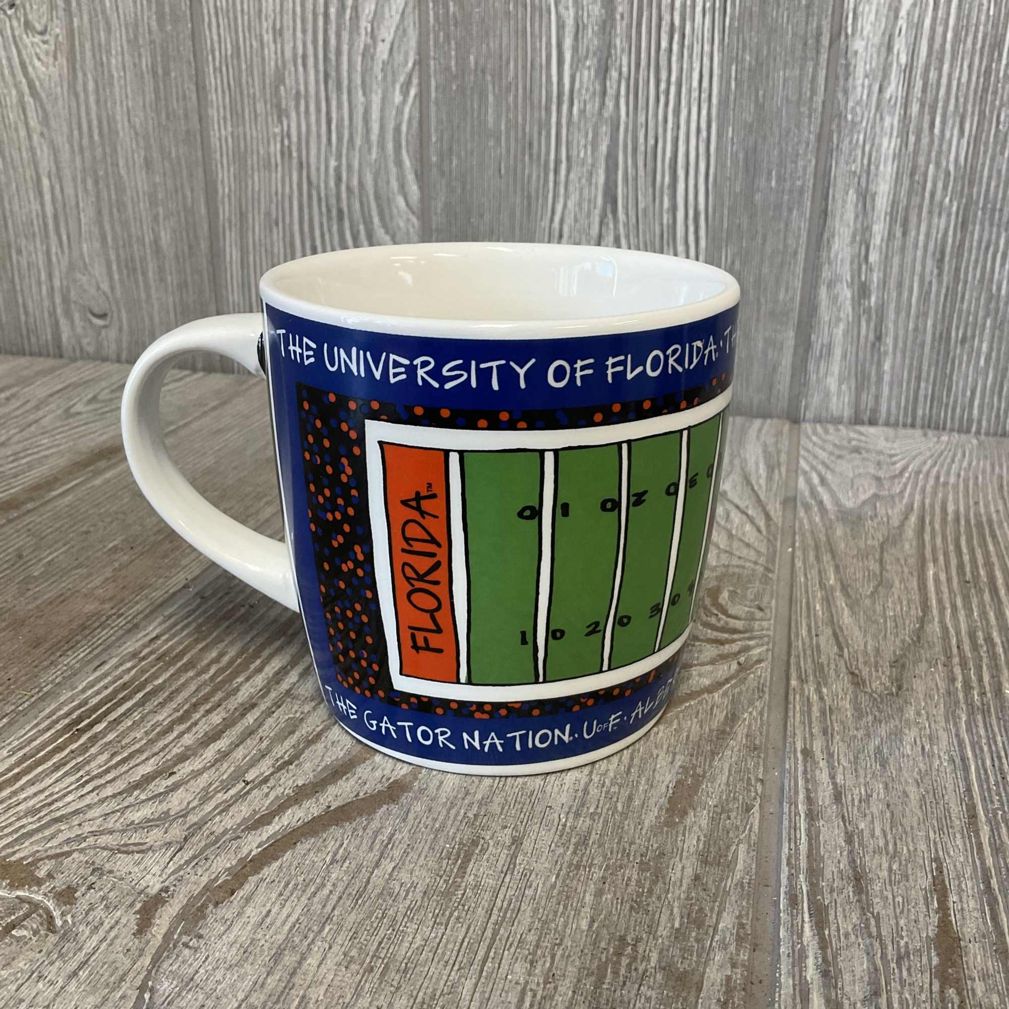University of Florida mug with a colorful football field design