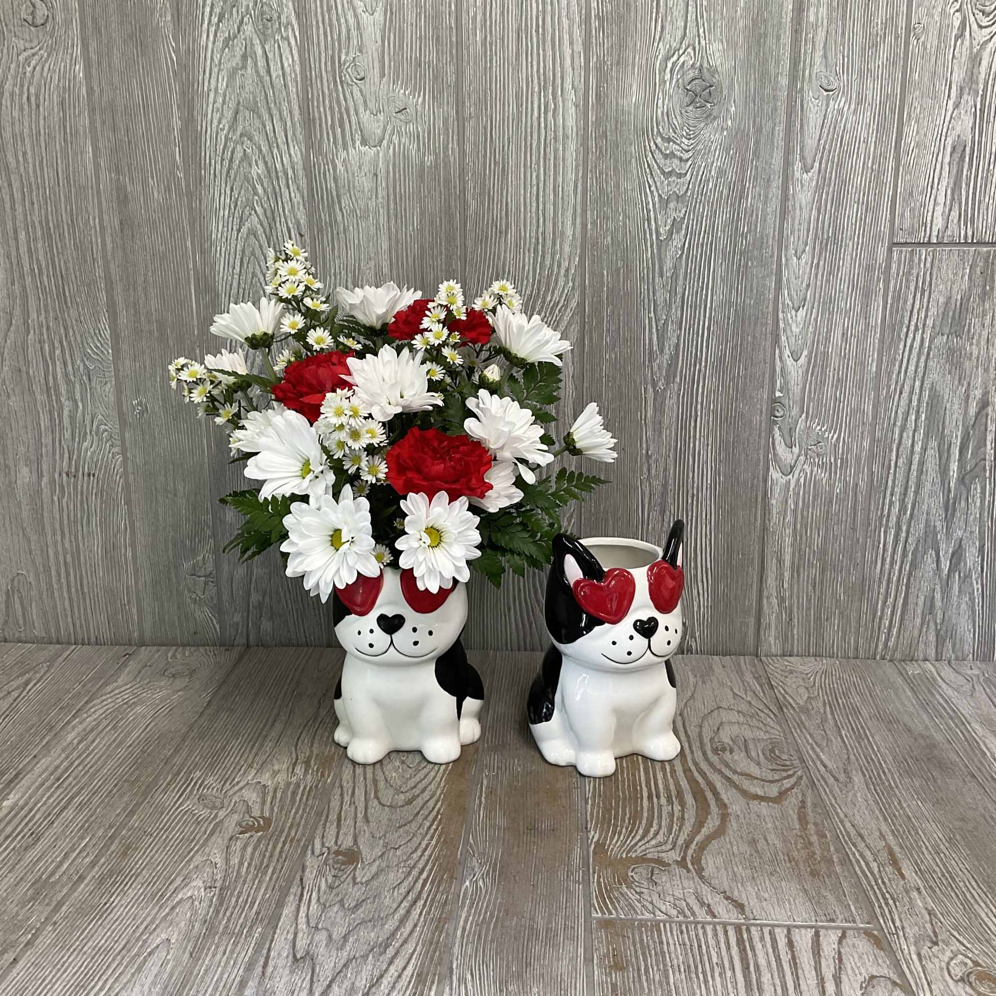 Beautiful fresh cut flowers arranged in a keepsake ceramic dog container. Flowers