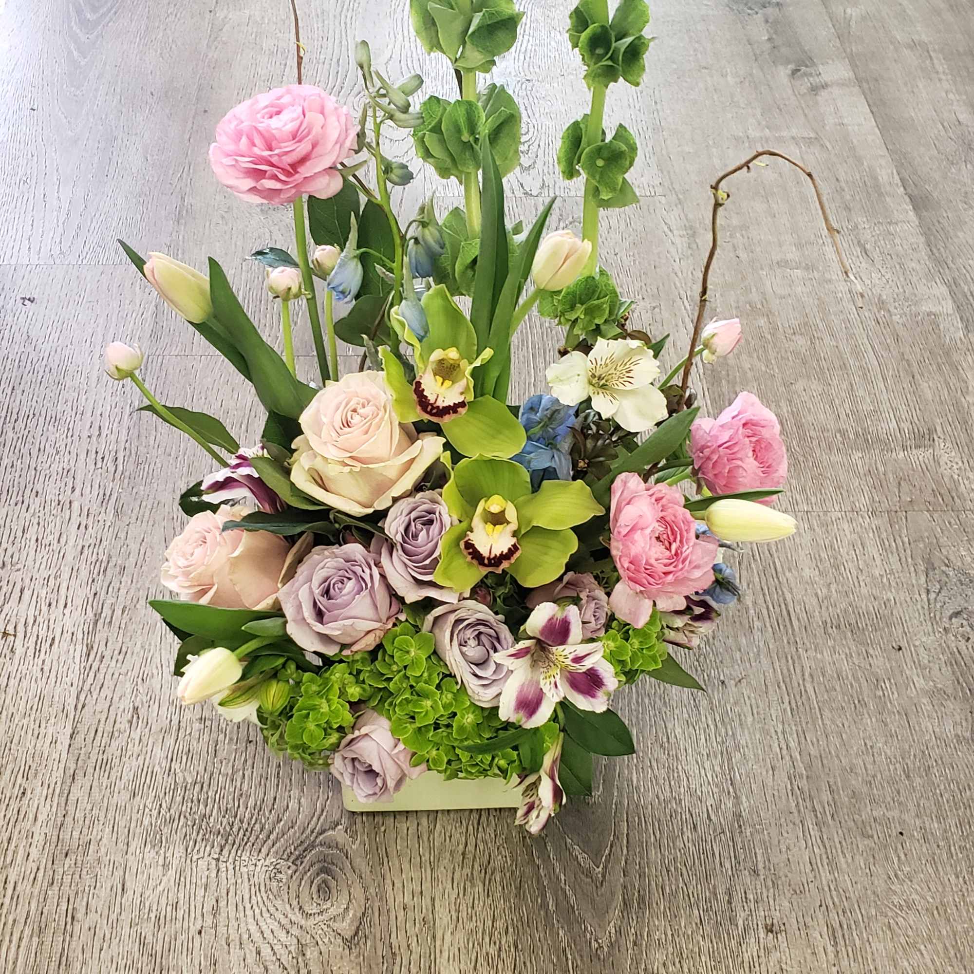 A vertical design with seasonal spring flowers in pastel mix Flowers may, photo 2 of 3