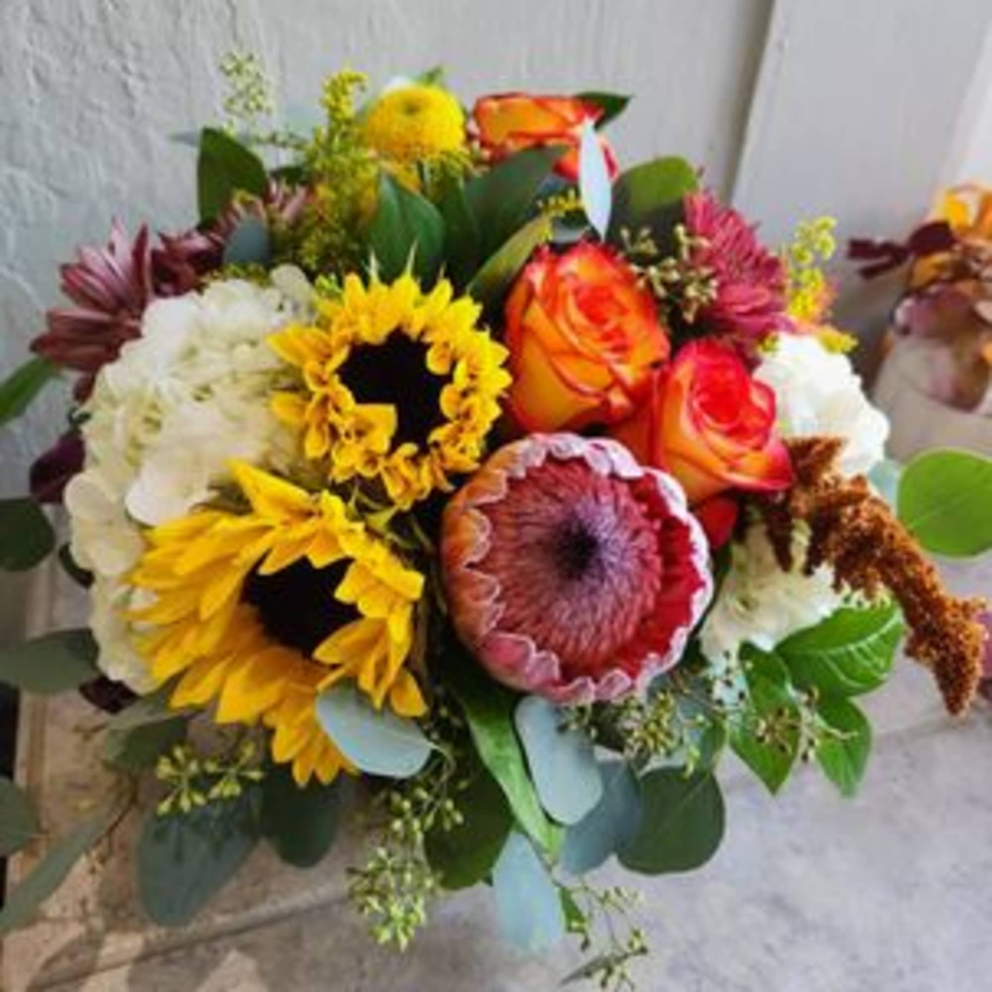 Mixed bouquet with sunflowers, orange roses, and white blooms, photo 2 of 3