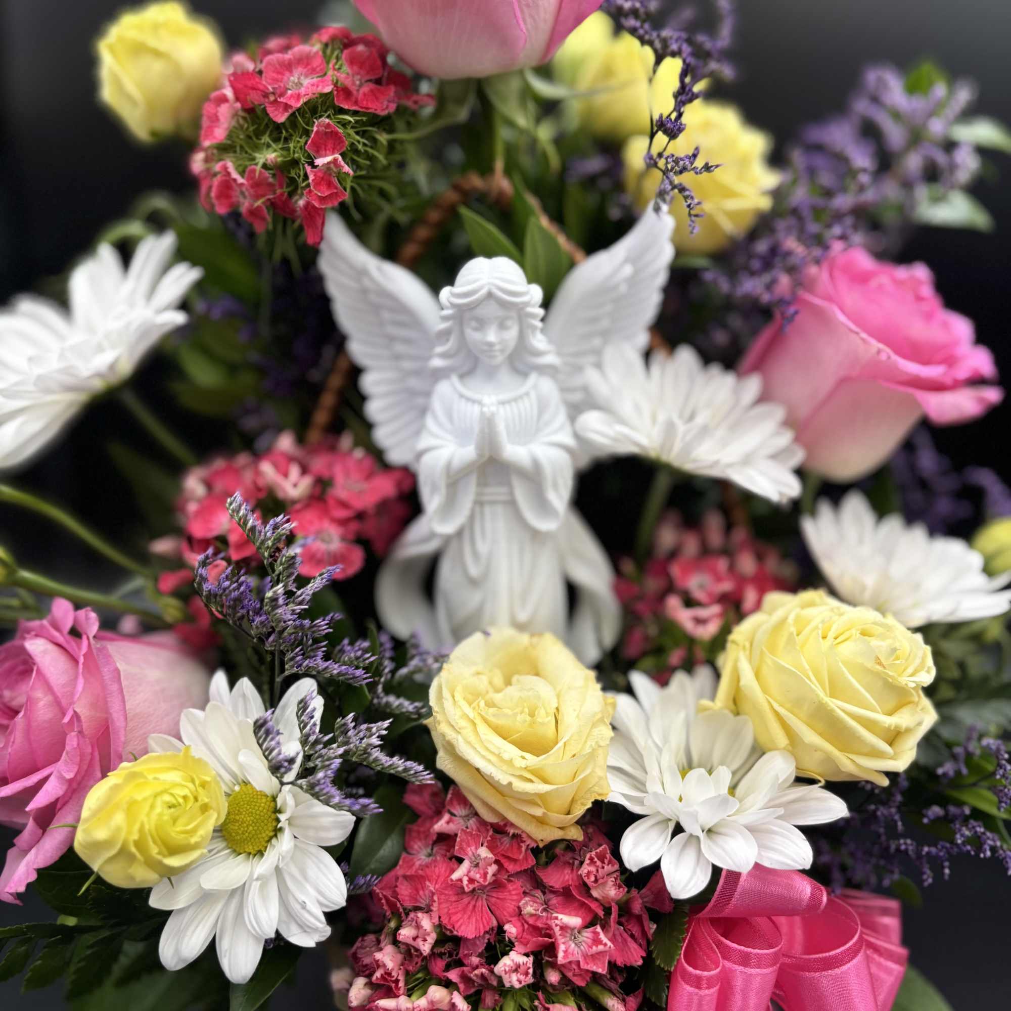 Fresh flowers in basket -Reasonable flower substitutions may be made due to