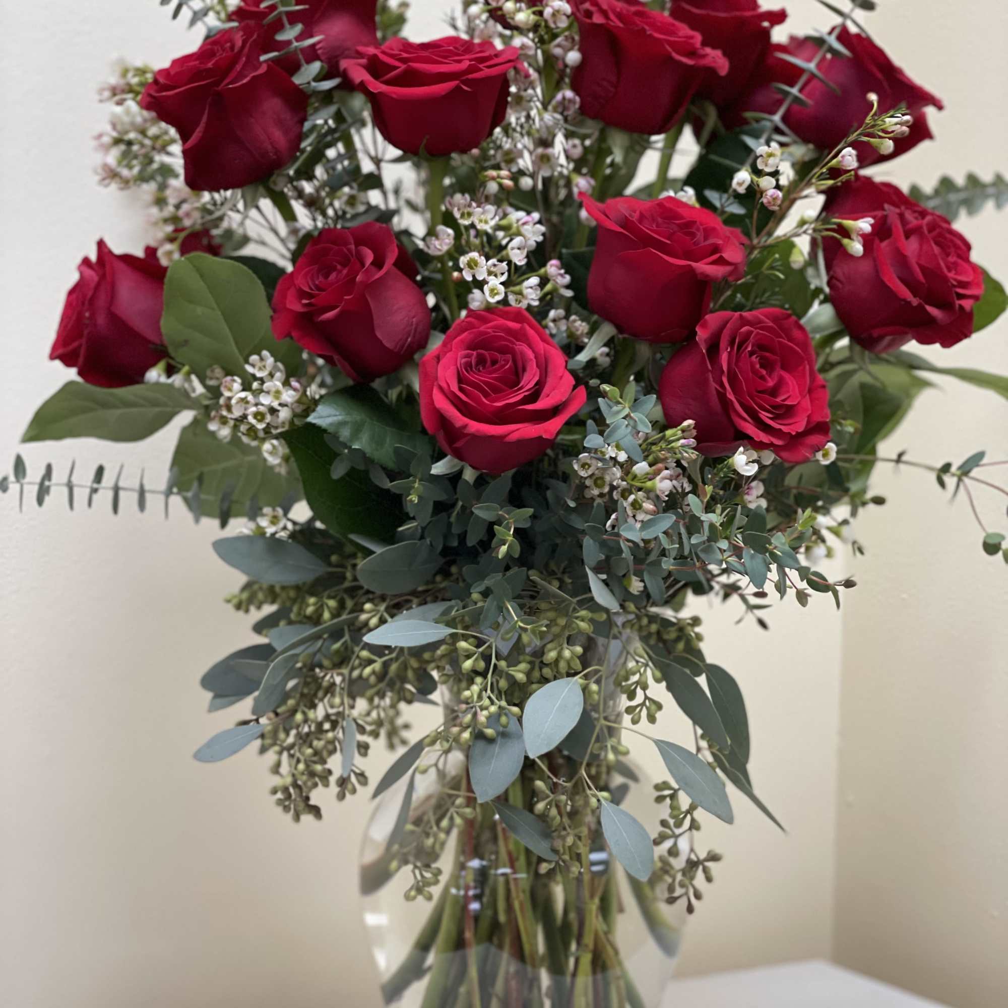 Bouquet of red roses in a clear glass vase