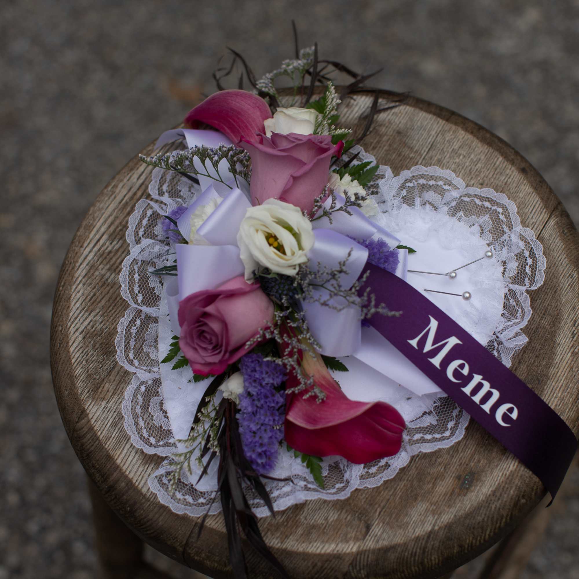 Small bouquet with pink and white flowers on lace trim