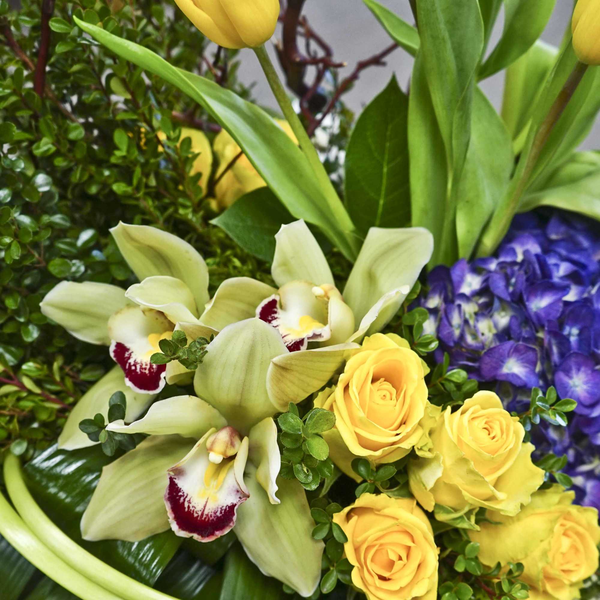 Bouquet with yellow roses, pale orchids, and purple hydrangea