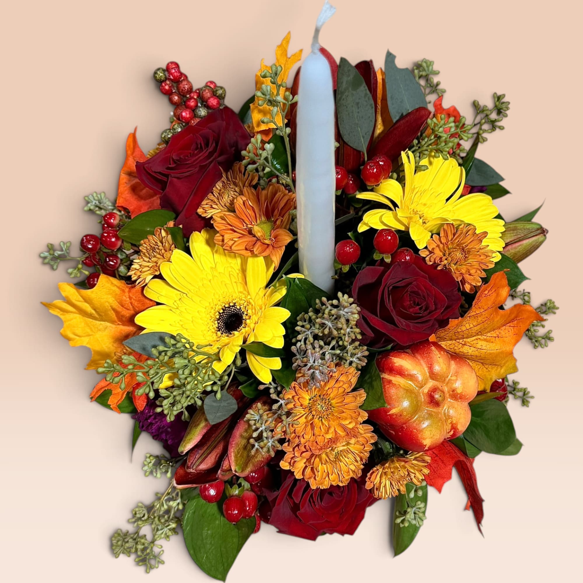Autumn floral arrangement with a candle in the center