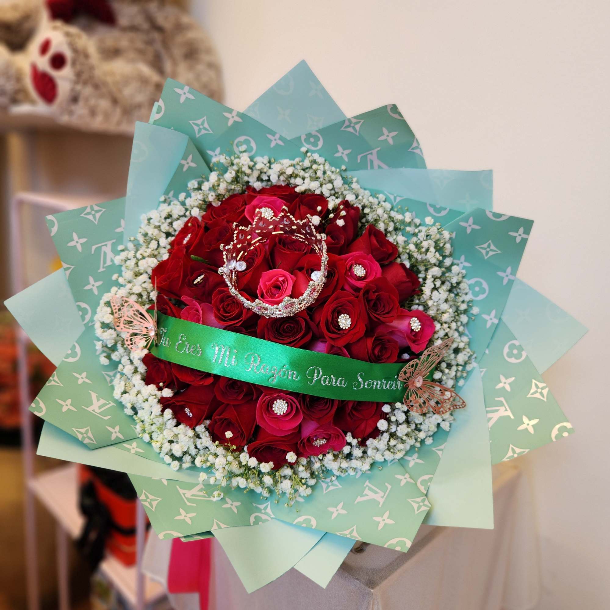 Bouquet of red roses with baby's breath and decorative ribbon