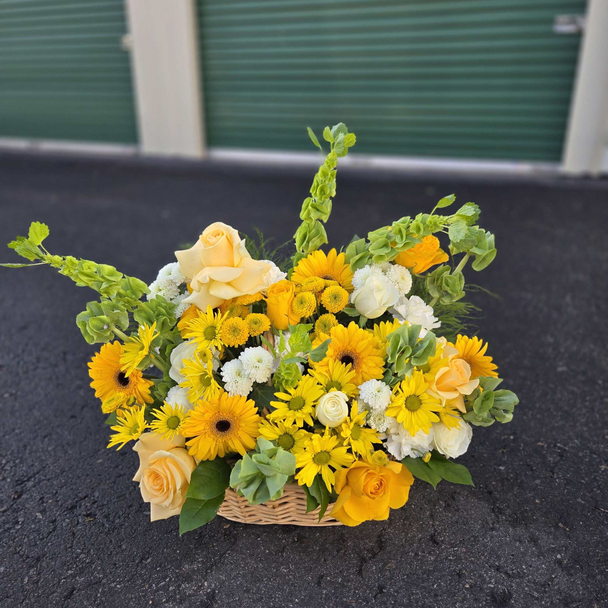 Yellow and cream flower basket with roses and daisies