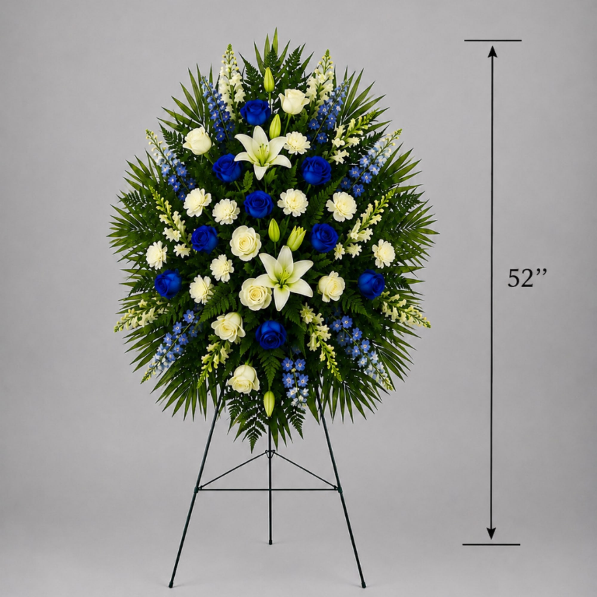 Tall standing floral spray with blue and white flowers on a metal easel