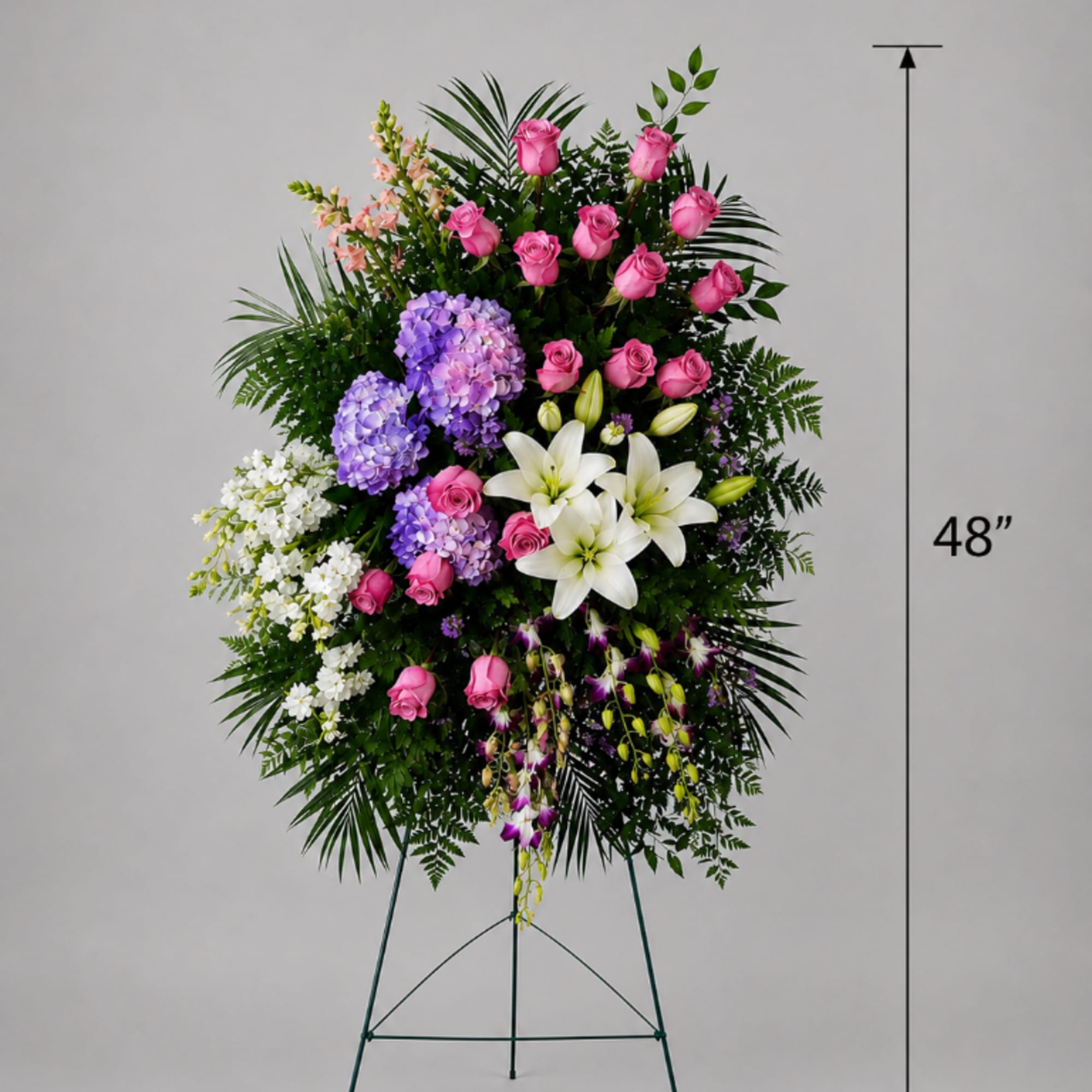 Tall standing floral spray with pink roses, white lilies, and purple hydrangeas