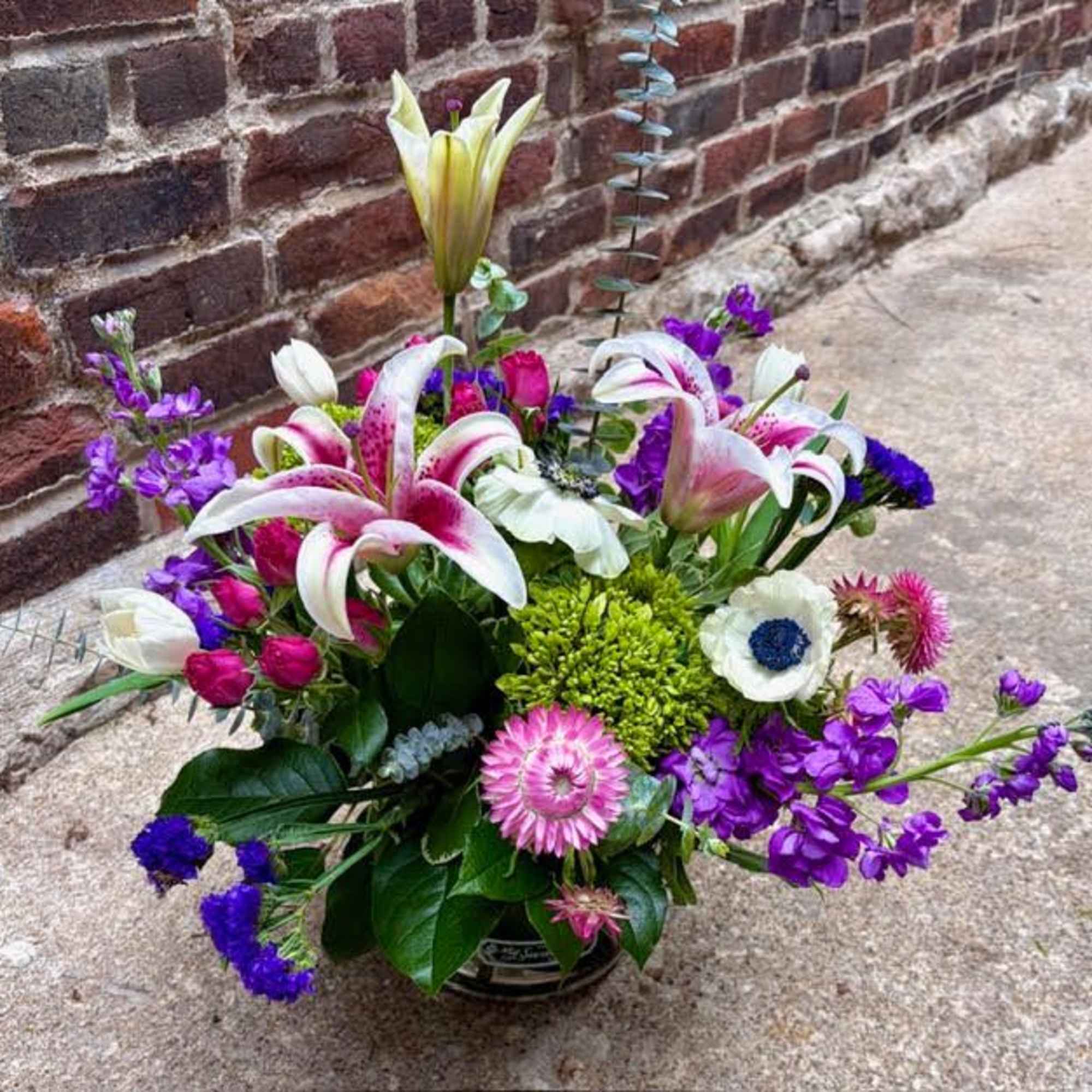A stunning garden design with stargazer lilies, tulips, spray roses, hydrangea, and, photo 2 of 3