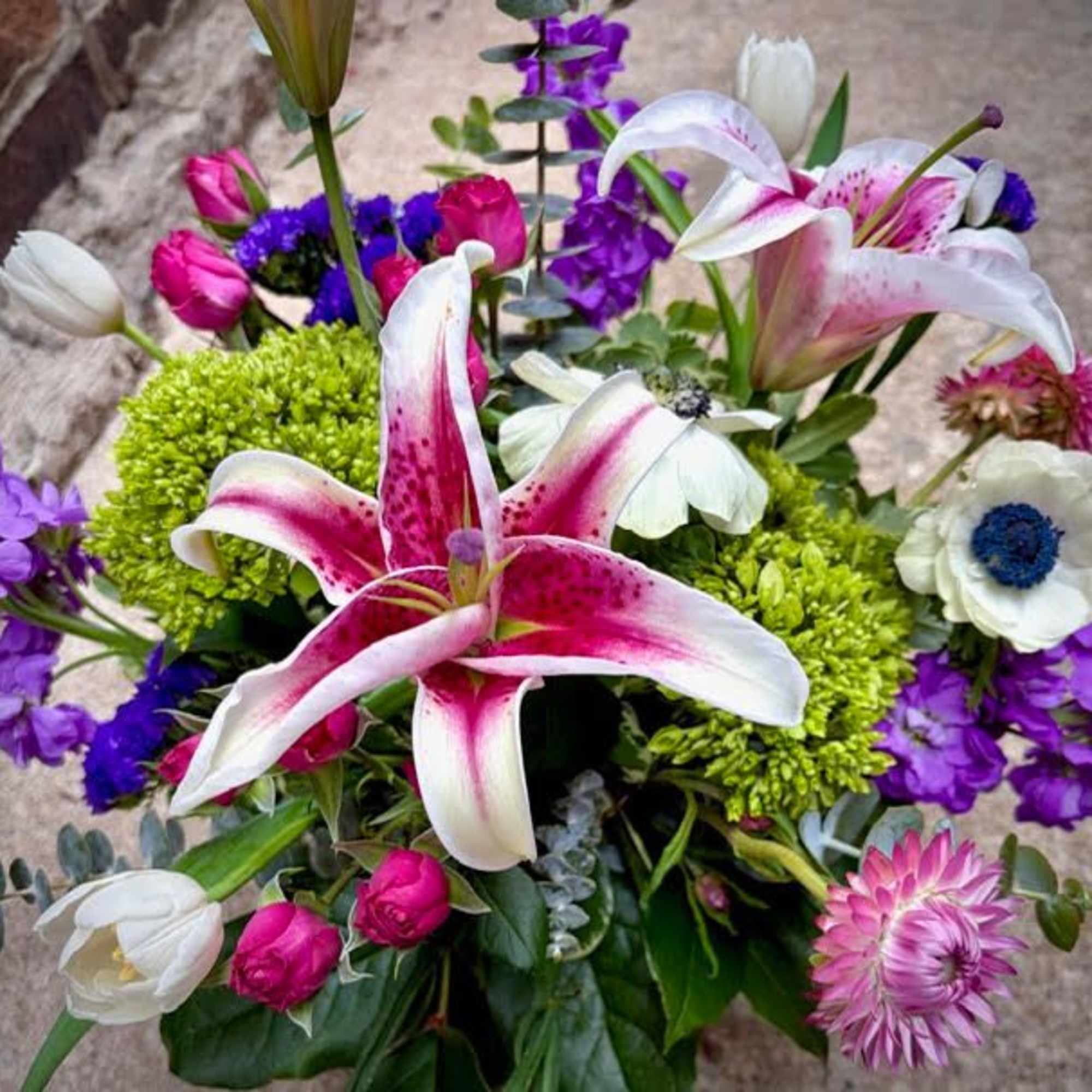 A stunning garden design with stargazer lilies, tulips, spray roses, hydrangea, and, photo 3 of 3