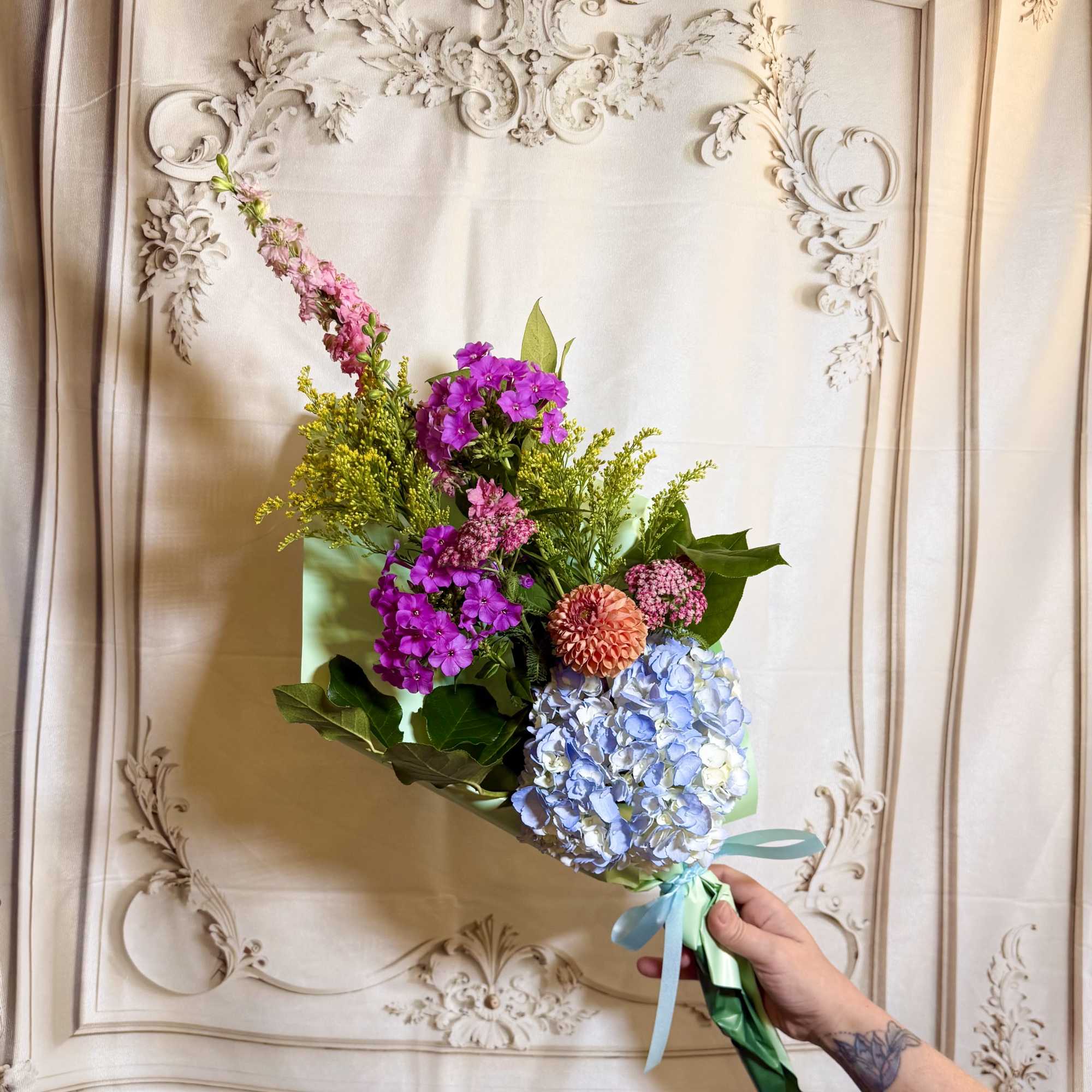 This beautiful wrapped bouquet Is filled with vibrant flowers grown in our, photo 2 of 4