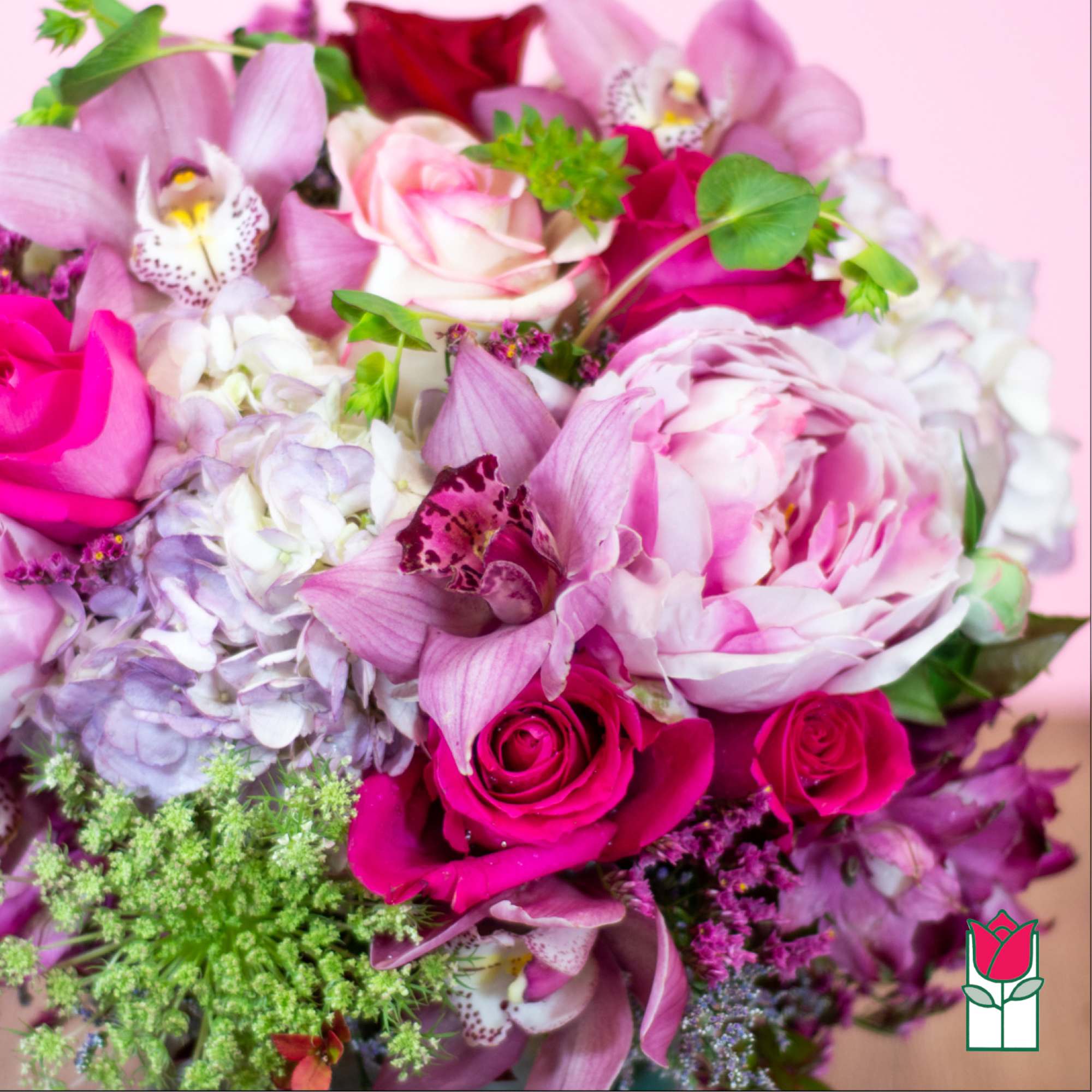 Pink and white bouquet with roses, orchids, and hydrangeas